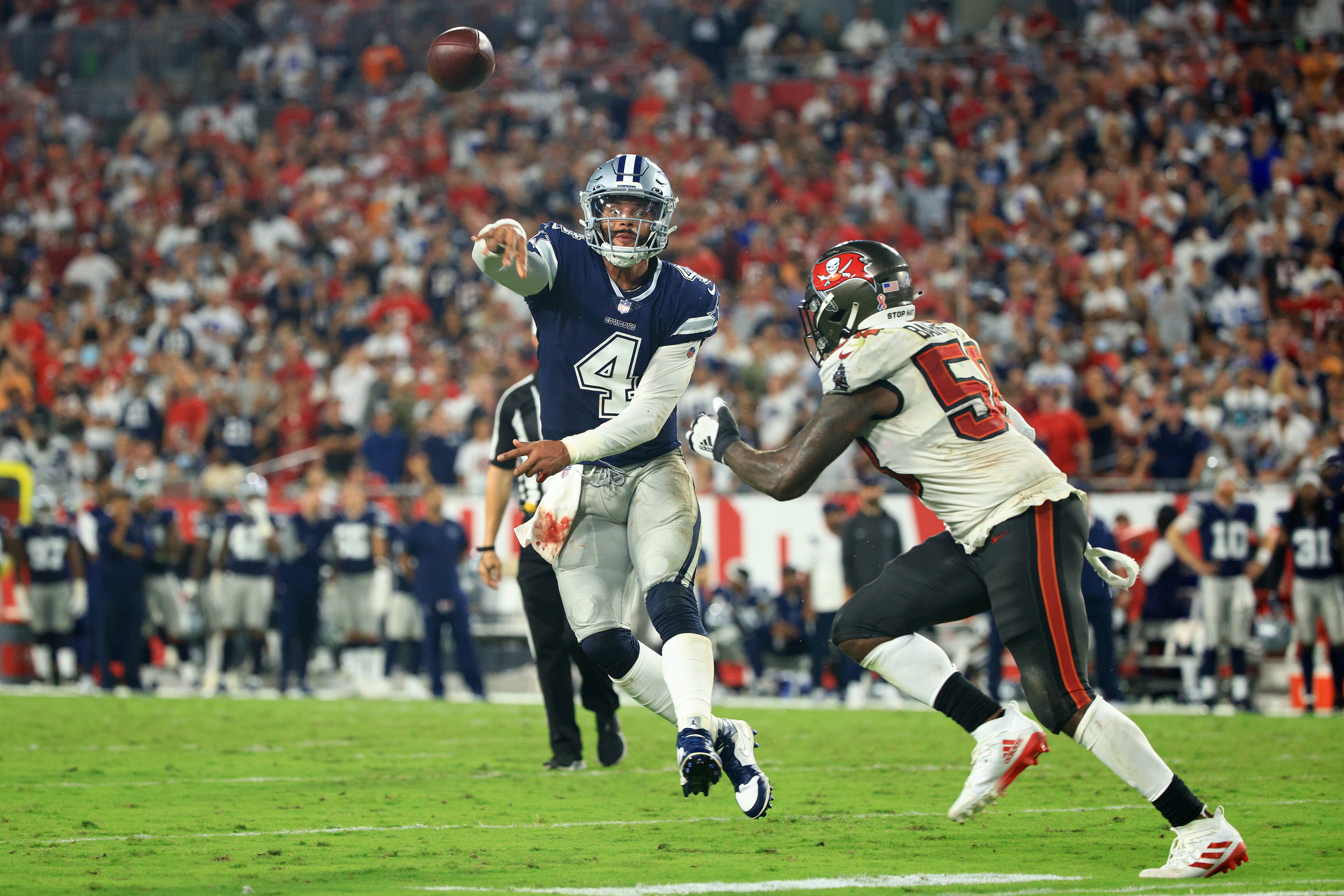 TAMPA, FLORIDA - SEPTEMBER 09: Dak Prescott #4 of the Dallas Cowboys passes during the third quarter against the Tampa Bay Buccaneers at Raymond James Stadium on September 09, 2021 in Tampa, Florida. (Photo by Mike Ehrmann/Getty Images)