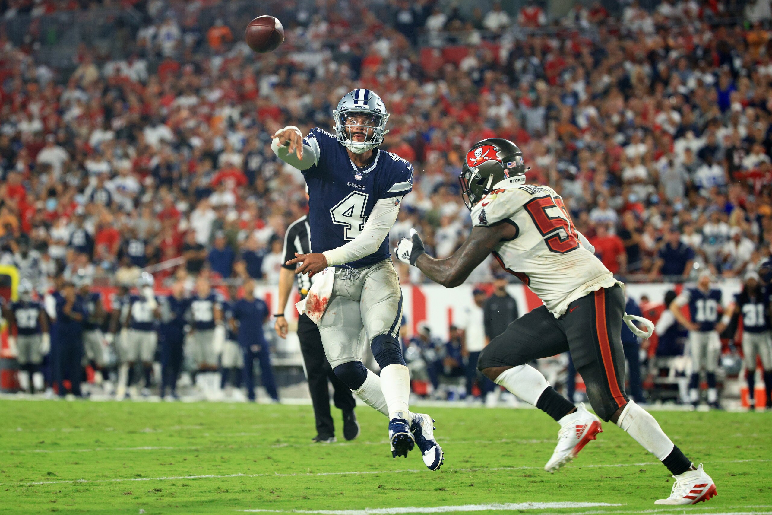 TAMPA, FLORIDA - SEPTEMBER 09: Dak Prescott #4 of the Dallas Cowboys passes during the third quarter against the Tampa Bay Buccaneers at Raymond James Stadium on September 09, 2021 in Tampa, Florida. (Photo by Mike Ehrmann/Getty Images)