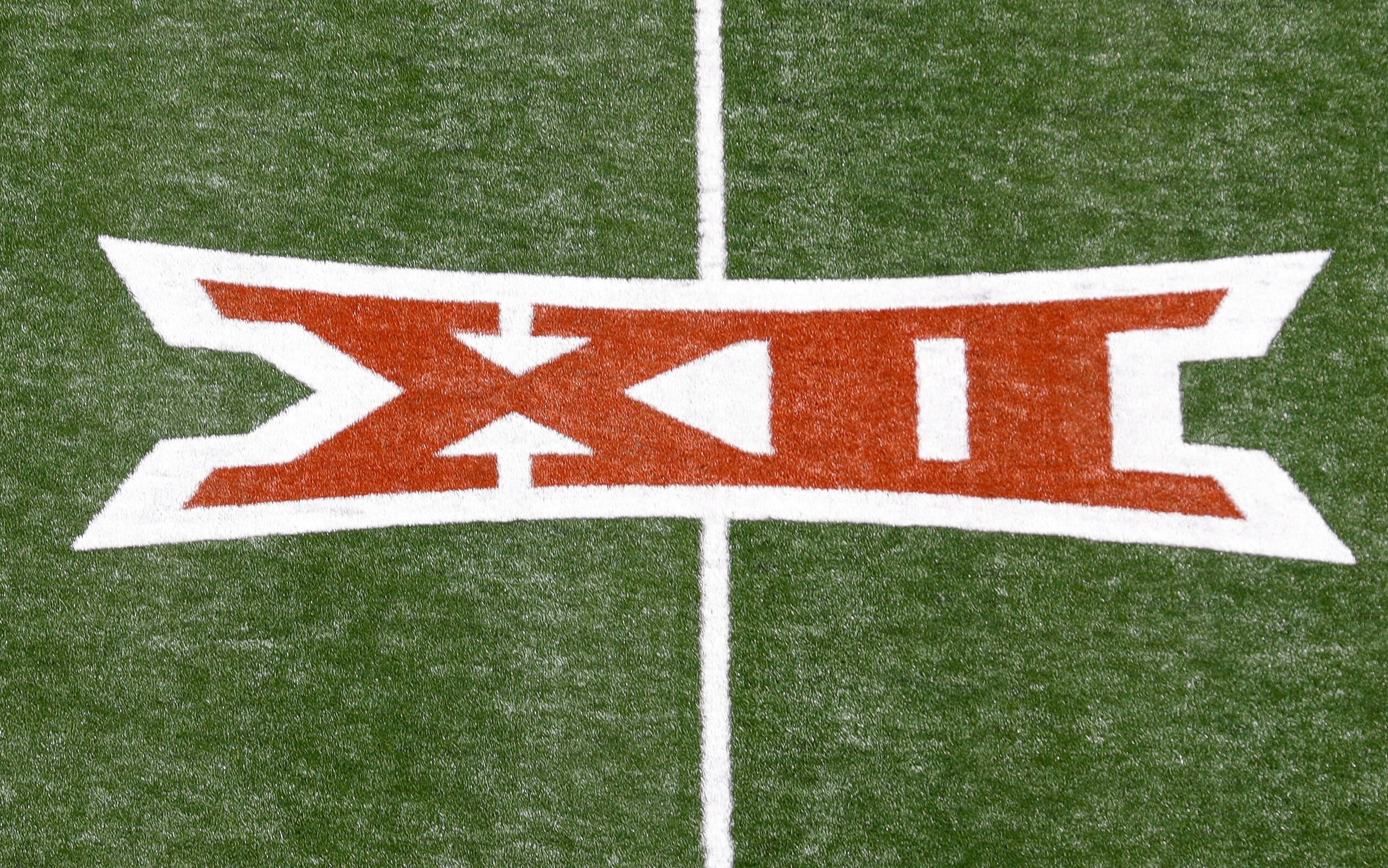 AUSTIN, TEXAS - SEPTEMBER 04: A Big 12 logo is seen on the turf before the game between the Texas Longhorns and the Louisiana Ragin' Cajuns at Darrell K Royal-Texas Memorial Stadium on September 04, 2021 in Austin, Texas. (Photo by Tim Warner/Getty Images)