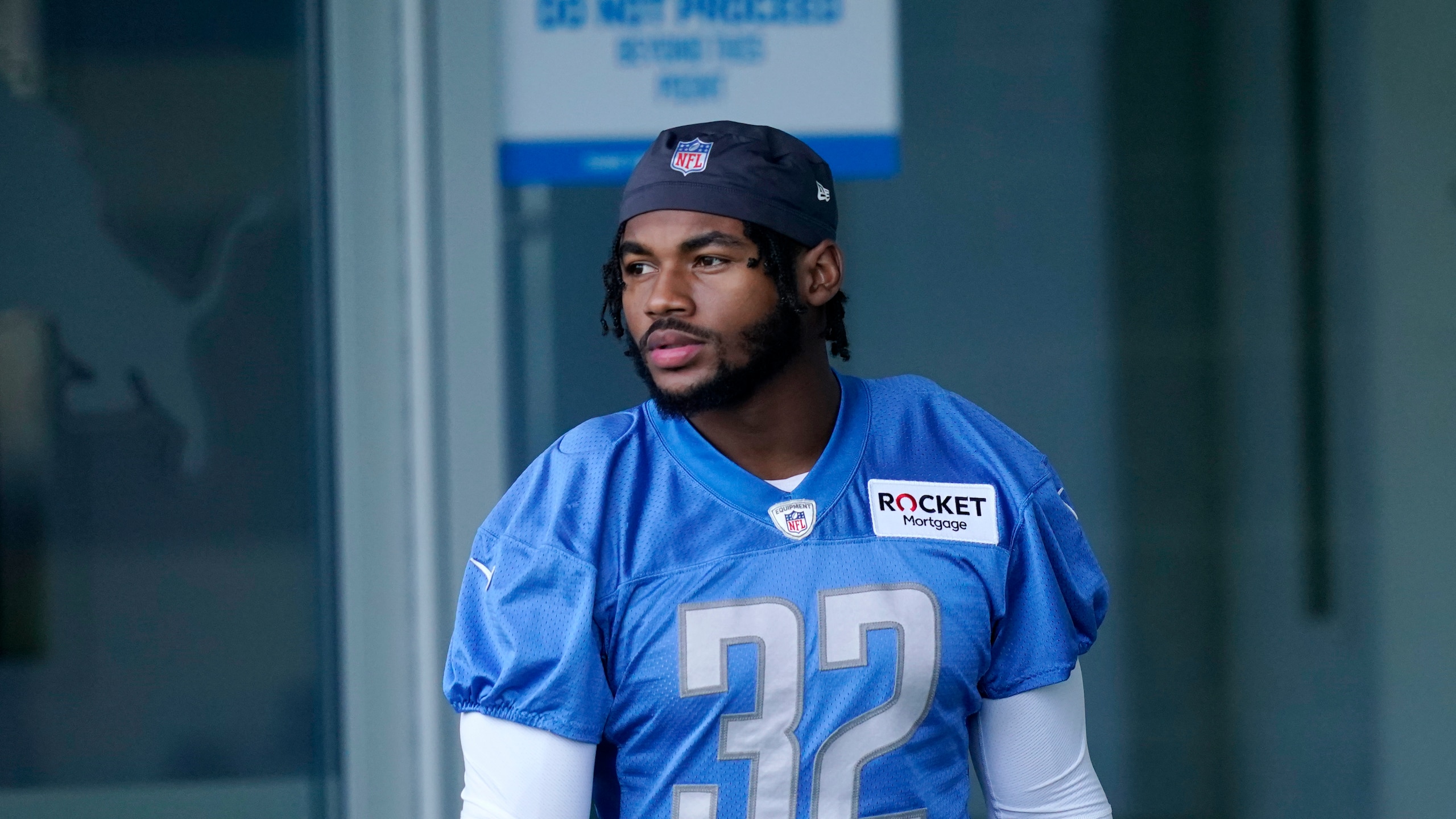 Detroit Lions running back D'Andre Swift walks to the field before drills at the Lions NFL football camp practice, Wednesday, July 28, 2021, in Allen Park, Mich. (AP Photo/Carlos Osorio)