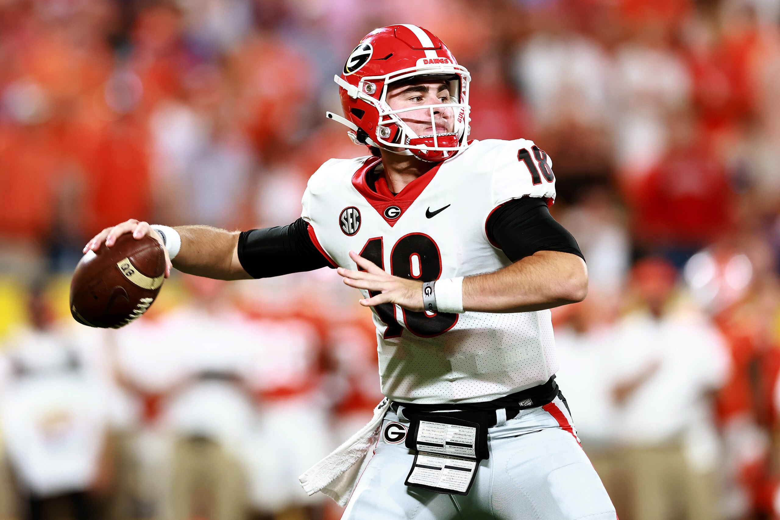 CHARLOTTE, NORTH CAROLINA - SEPTEMBER 04: JT Daniels #18 of the Georgia Bulldogs drops back to pass against the Clemson Tigers during the first half of the Duke's Mayo Classic at Bank of America Stadium on September 04, 2021 in Charlotte, North Carolina. (Photo by Grant Halverson/Getty Images)