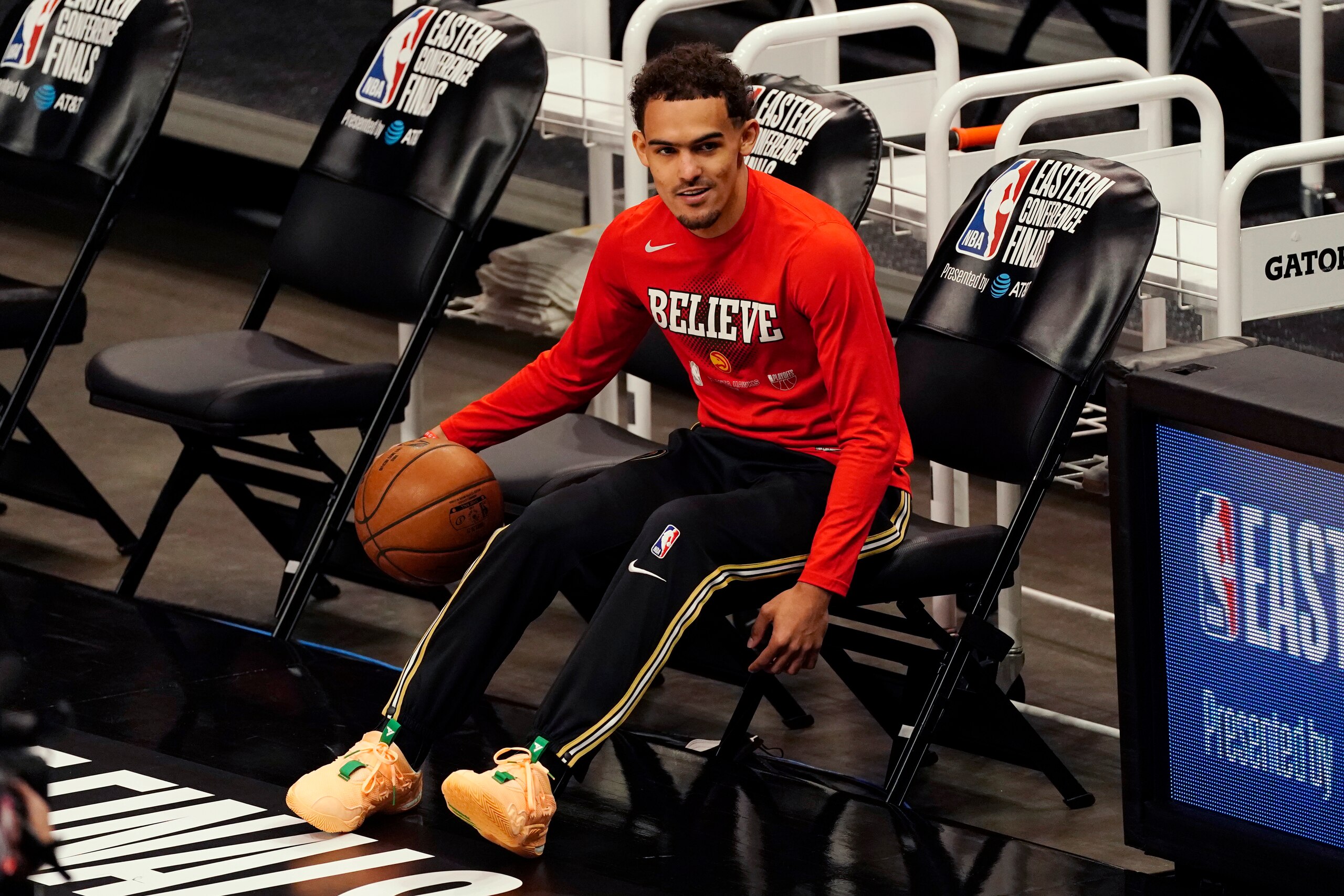 Atlanta Hawks guard Trae Young warms up before Game 6 of the team's NBA basketball playoffs Eastern Conference finals against the Milwaukee Bucks, Saturday, July 3, 2021, in Atlanta. (AP Photo/John Bazemore) Atlanta Hawks guard Trae Young warms up before Game 6 of the team's NBA basketball playoffs Eastern Conference finals against the Milwaukee Bucks, Saturday, July 3, 2021, in Atlanta. (AP Photo/John Bazemore)