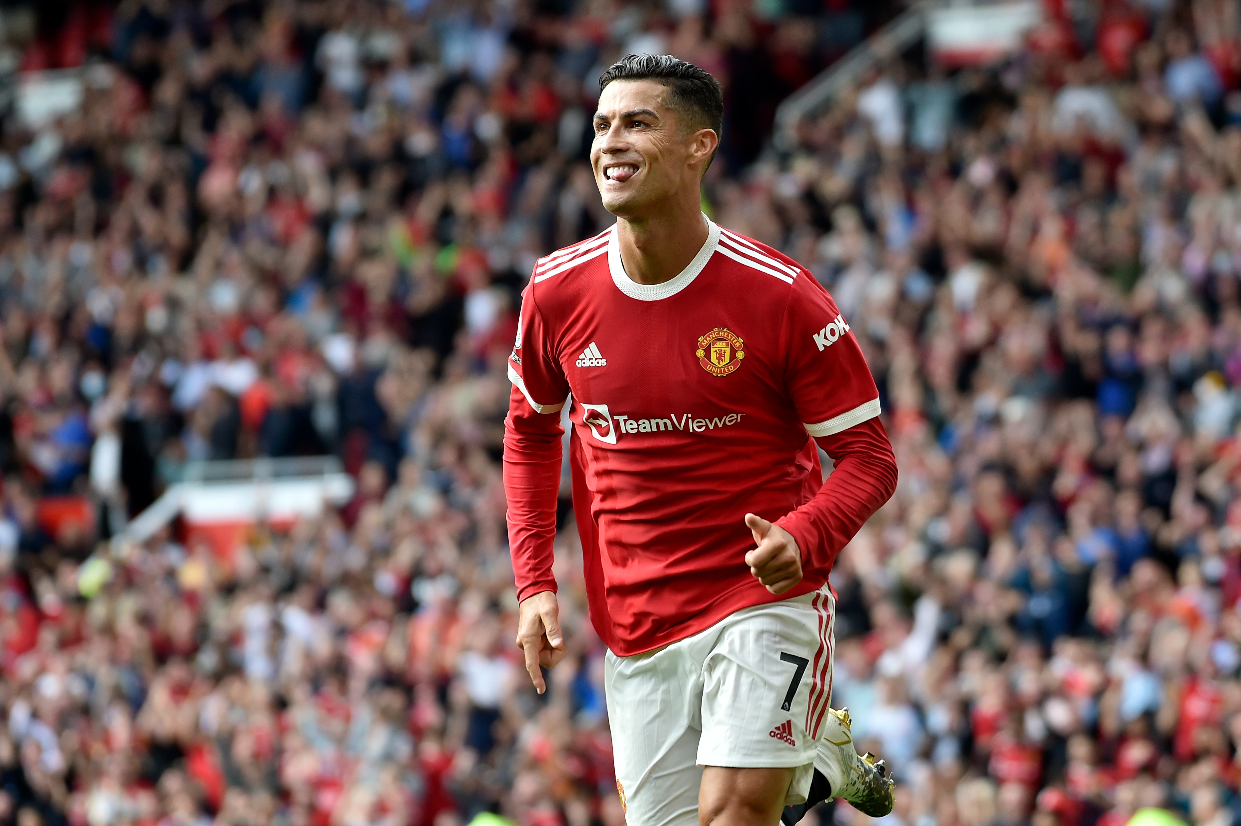 Manchester United's Cristiano Ronaldo celebrates after scoring the opening goal during the English Premier League soccer match between Manchester United and Newcastle United at Old Trafford stadium in Manchester, England, Saturday, Sept. 11, 2021. (AP Photo/Rui Vieira)