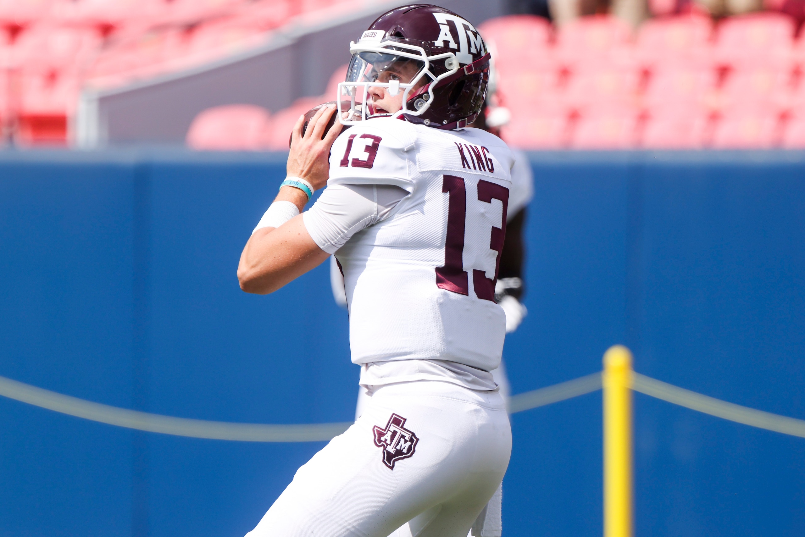 DENVER, CO - SEPTEMBER 11: Haynes King #13 of the Texas A&M Aggies warms up before playing the Colorado Buffaloes at Empower Field At Mile High on September 11, 2021 in Denver, Colorado. (Photo by Michael Ciaglo/Getty Images)