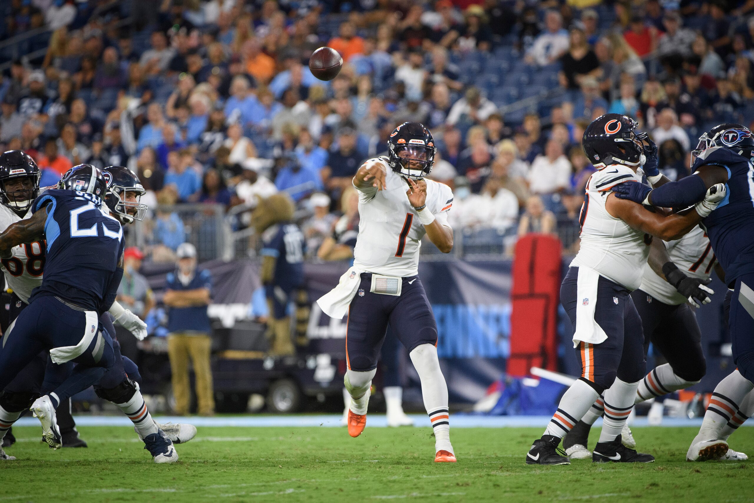 Chicago Bears quarterback Justin Fields (1) passes against the Tennessee Titans during an NFL football game Saturday, Aug. 28, 2021, in Nashville, Tenn. (AP Photo/John Amis)