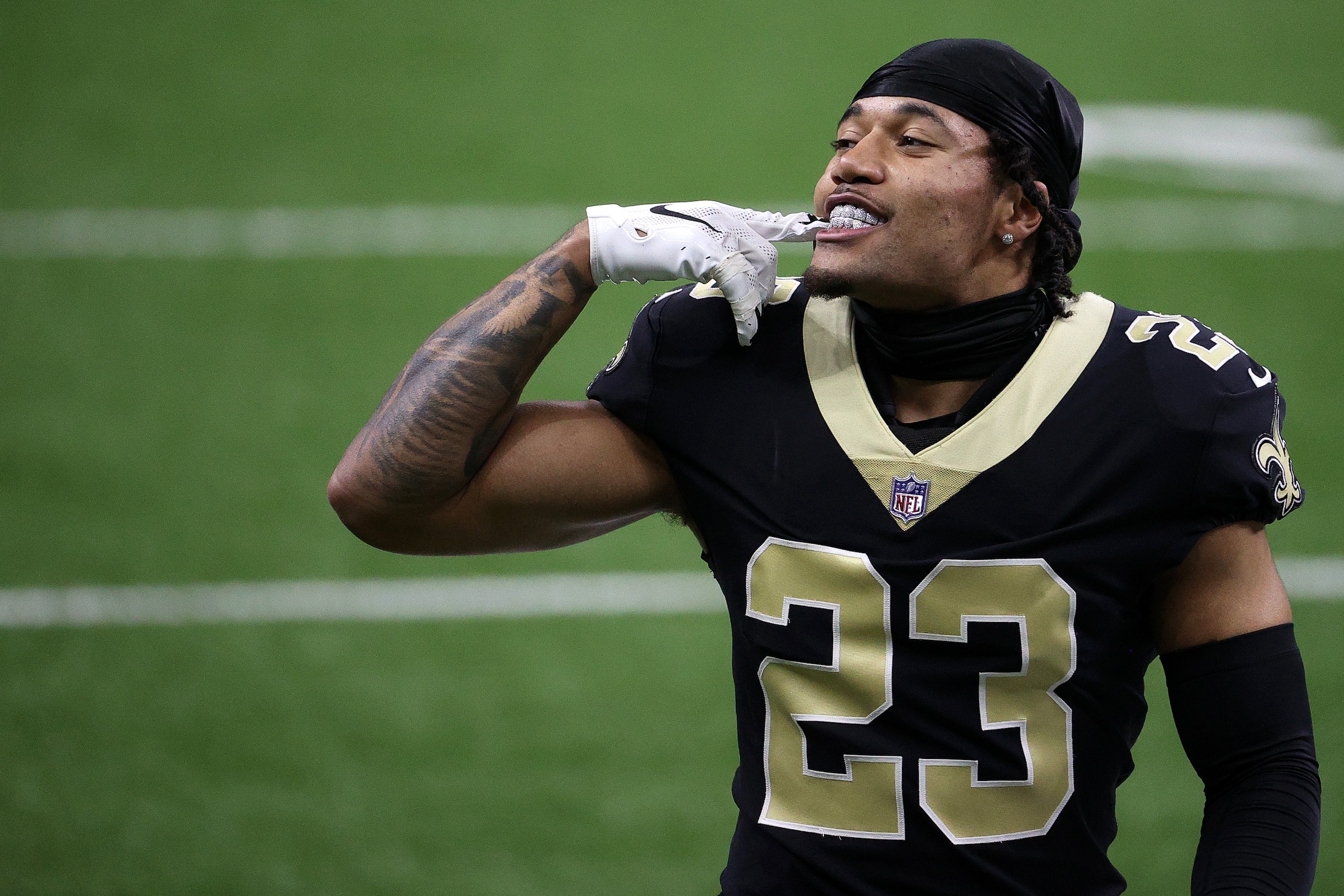 NEW ORLEANS, LOUISIANA - JANUARY 17: Marshon Lattimore #23 of the New Orleans Saints shows his teeth on the field prior to the NFC Divisional Playoff game against the Tampa Bay Buccaneers  at Mercedes Benz Superdome on January 17, 2021 in New Orleans, Louisiana. (Photo by Chris Graythen/Getty Images)