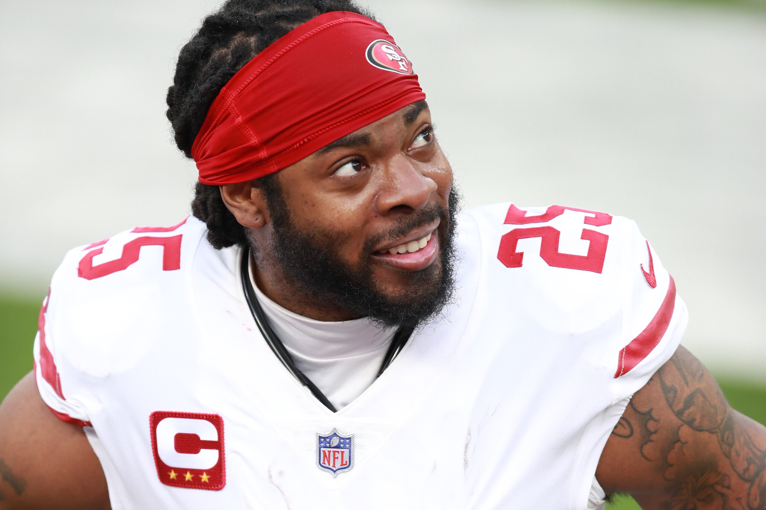INGLEWOOD, CALIFORNIA - NOVEMBER 29: Richard Sherman #25 of the San Francisco 49ers speaks to a teammate on the bench in the second quarter against the Los Angeles Rams at SoFi Stadium on November 29, 2020 in Inglewood, California. (Photo by Joe Scarnici/Getty Images)