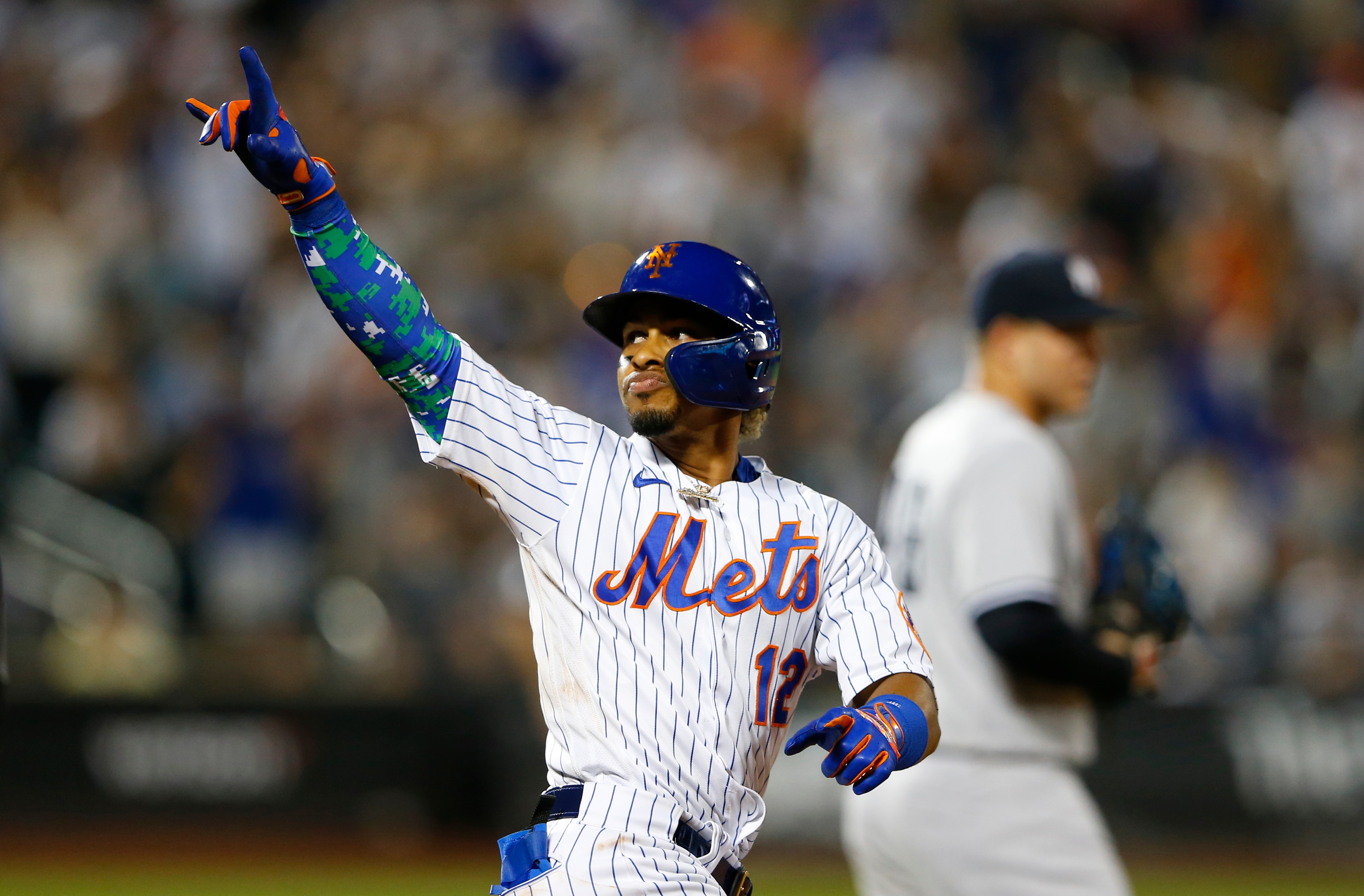 New York Mets' Francisco Lindor (12) reacts after his second home run in a baseball game against the New York Yankees in the sixth inning, Sunday, Sept. 12, 2021, in New York. (AP Photo/Noah K. Murray)