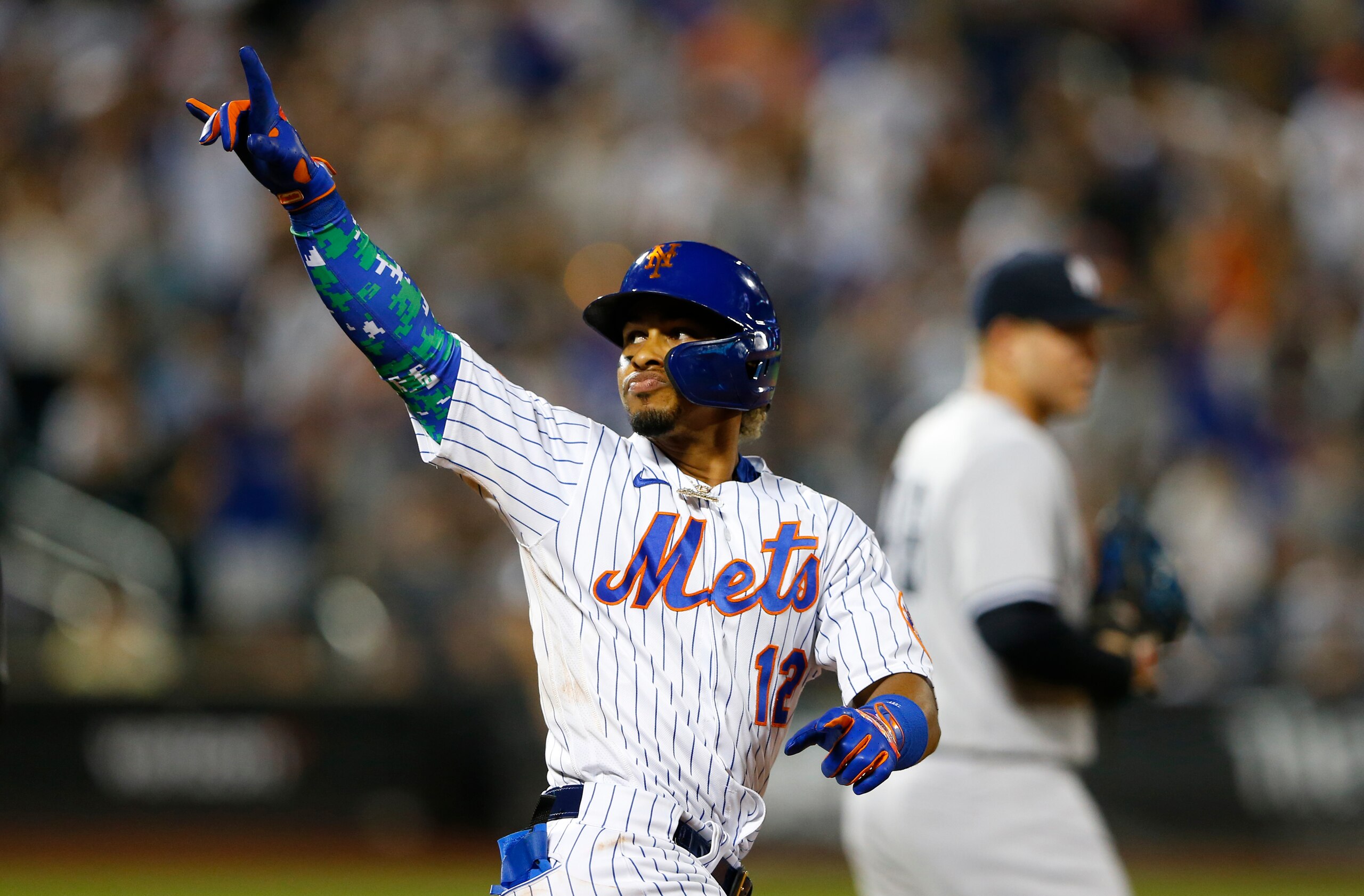New York Mets' Francisco Lindor (12) reacts after his second home run in a baseball game against the New York Yankees in the sixth inning, Sunday, Sept. 12, 2021, in New York. (AP Photo/Noah K. Murray)
