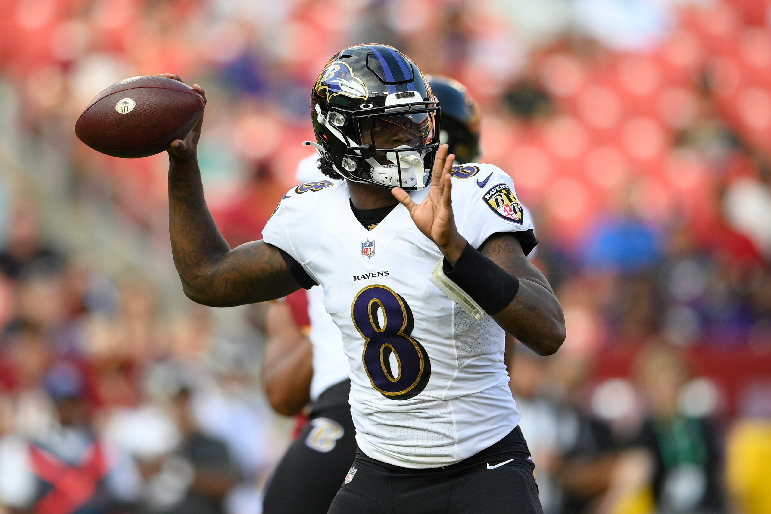 Baltimore Ravens quarterback Lamar Jackson in action during the first half of a preseason NFL football game against the Washington Football Team, Saturday, Aug. 28, 2021, in Landover, Md. (AP Photo/Nick Wass)