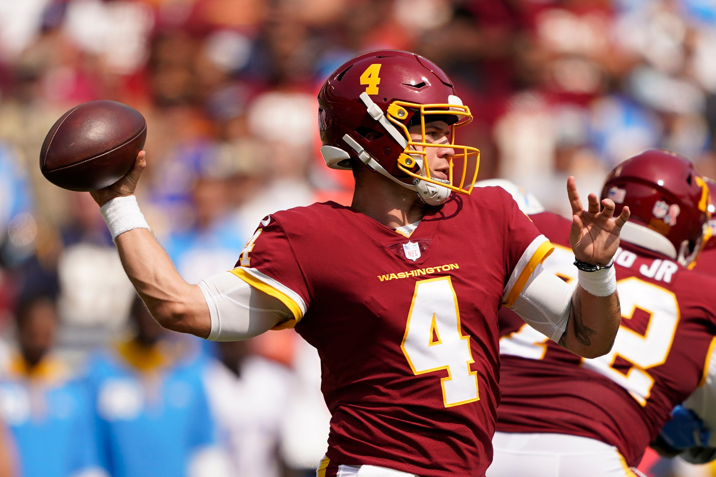 Washington Football Team quarterback Taylor Heinicke (4) throws the ball against the Los Angeles Chargers during the first half of an NFL football game, Sunday, Sept. 12, 2021, in Landover, Md. (AP Photo/Andrew Harnik)
