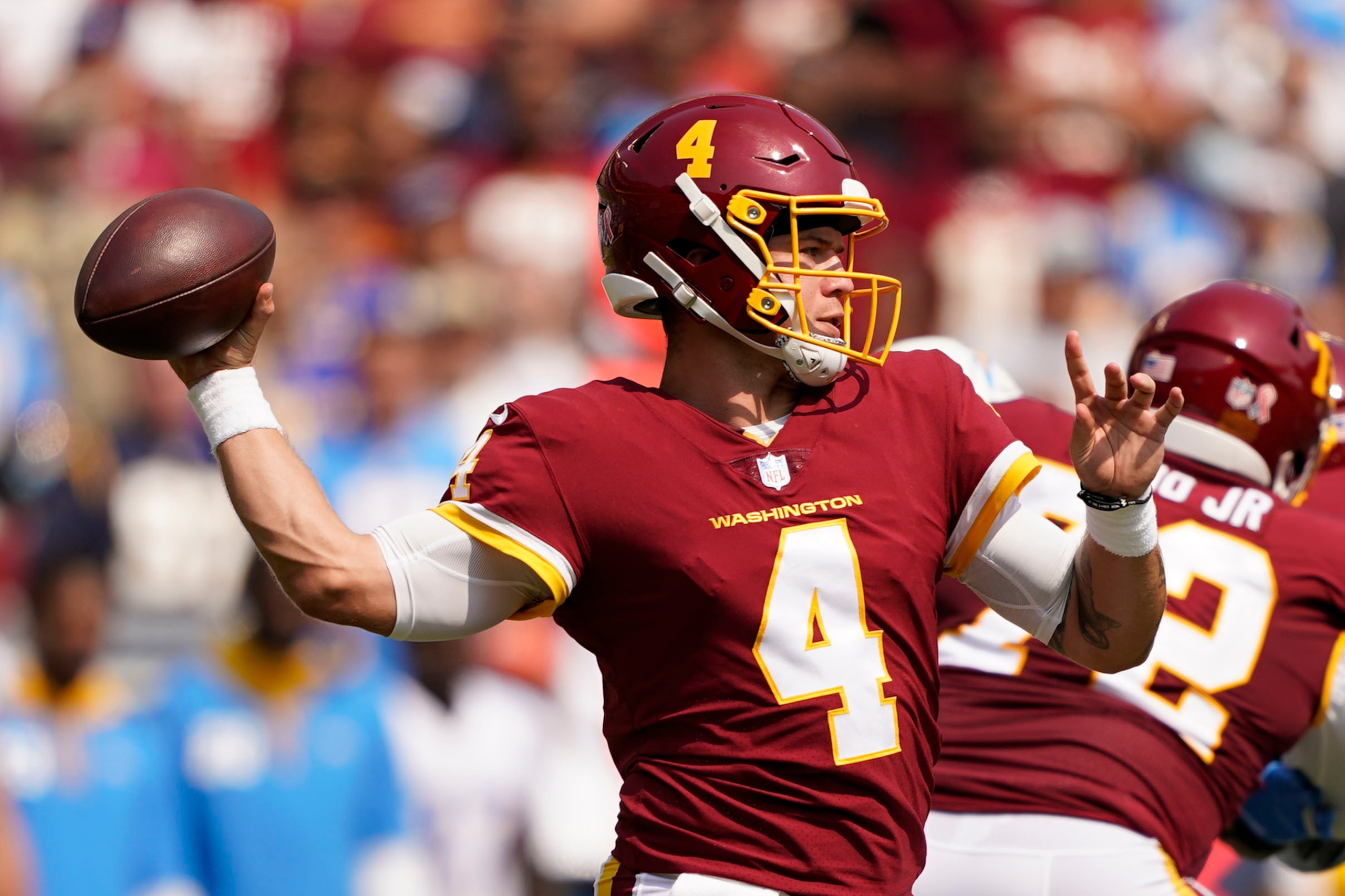 Washington Football Team quarterback Taylor Heinicke (4) throws the ball against the Los Angeles Chargers during the first half of an NFL football game, Sunday, Sept. 12, 2021, in Landover, Md. (AP Photo/Andrew Harnik)