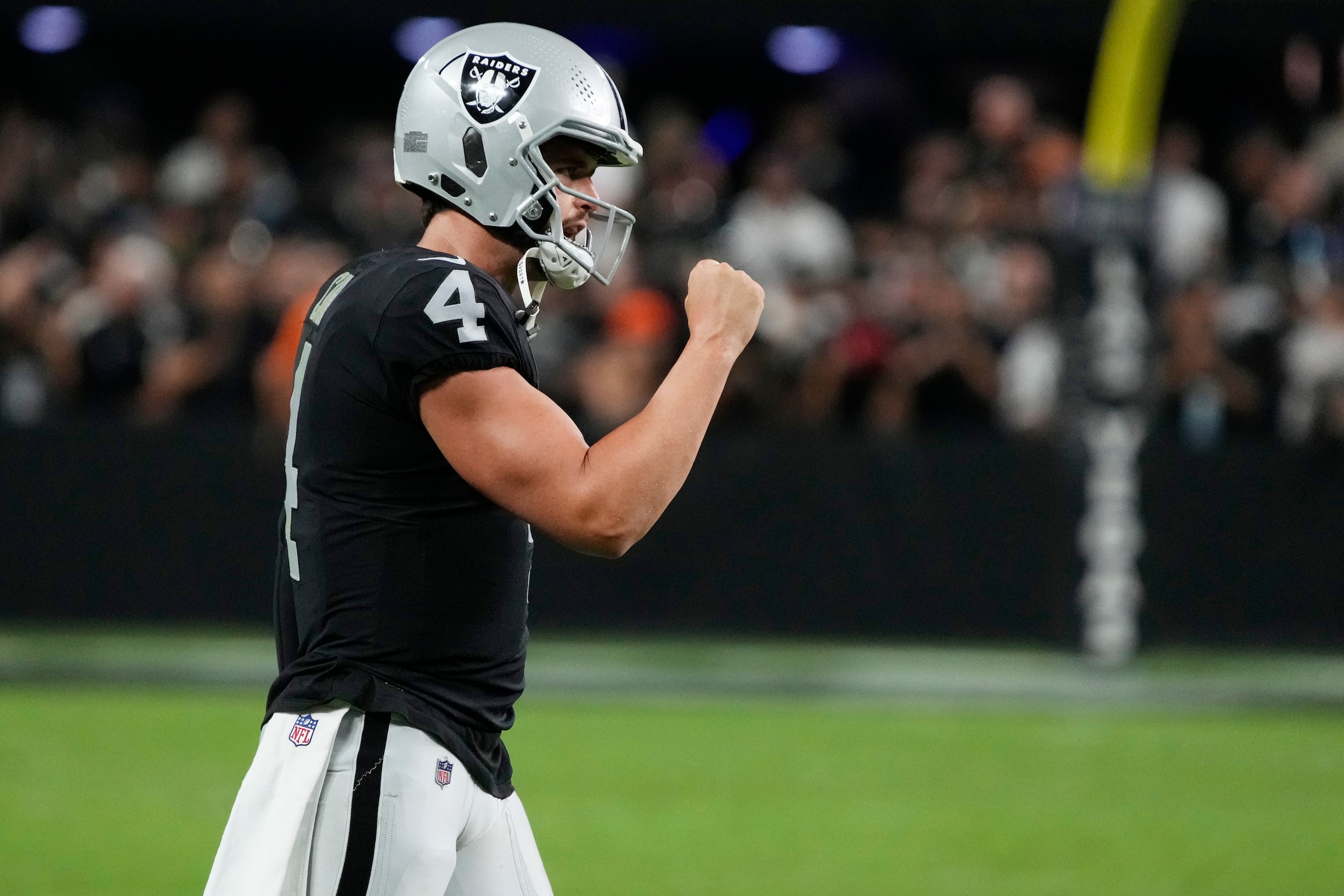 Las Vegas Raiders quarterback Derek Carr (4) celebrates after his team scored a touchdown against the Baltimore Ravens during the second half of an NFL football game, Monday, Sept. 13, 2021, in Las Vegas. (AP Photo/Rick Scuteri)