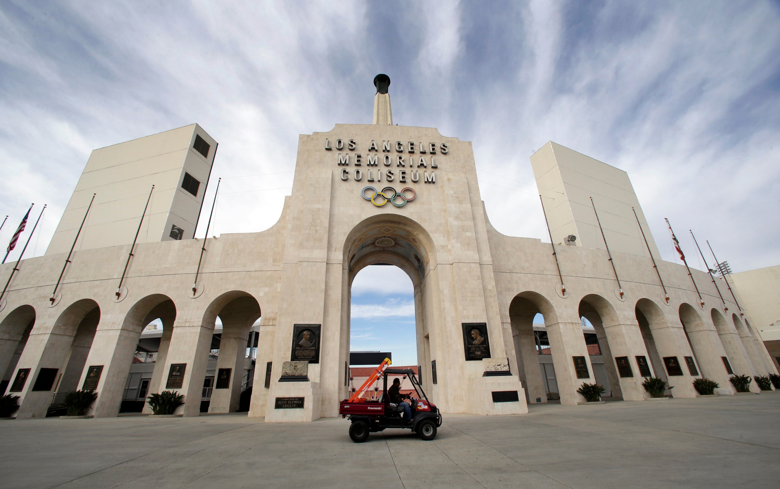 FILE - This Jan. 13, 2016 file photo shows the peristyle of the Los Angeles Memorial Coliseum in Los Angeles. United Airlines and the University of Southern California have reached a new naming rights agreement for Los Angeles Memorial Coliseum to resolve criticism that putting a corporate name on the stadium disrespects its role as a World War I monument. (AP Photo/Nick Ut, File)