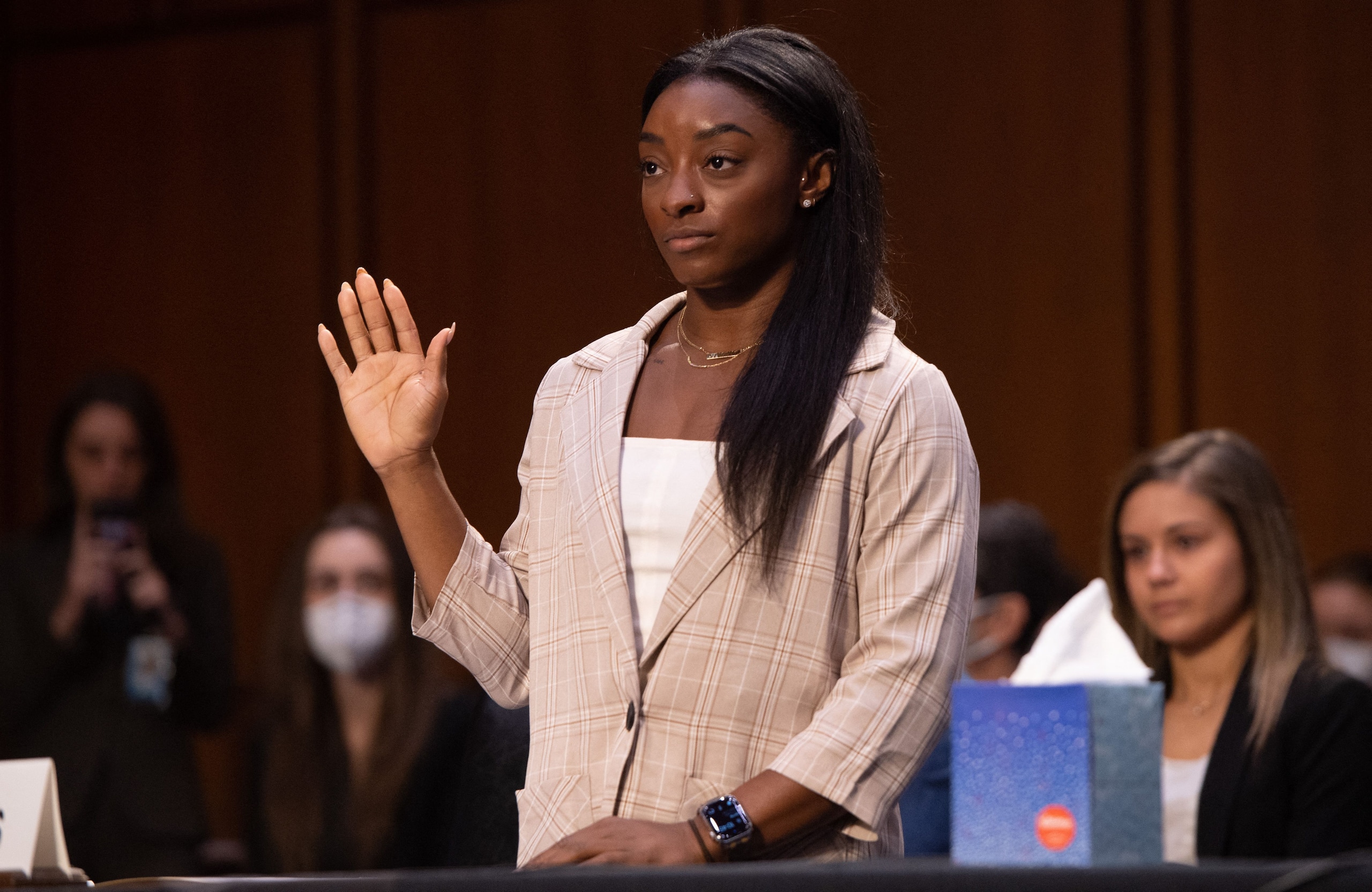 US Olympic gymnasts Simone Biles is sworn in to testify during a Senate Judiciary hearing about the Inspector General's report on the FBI handling of the Larry Nassar investigation of sexual abuse of Olympic gymnasts, on Capitol Hill, September 15, 2021, in Washington, DC. (Photo by SAUL LOEB / POOL / AFP) (Photo by SAUL LOEB/POOL/AFP via Getty Images)