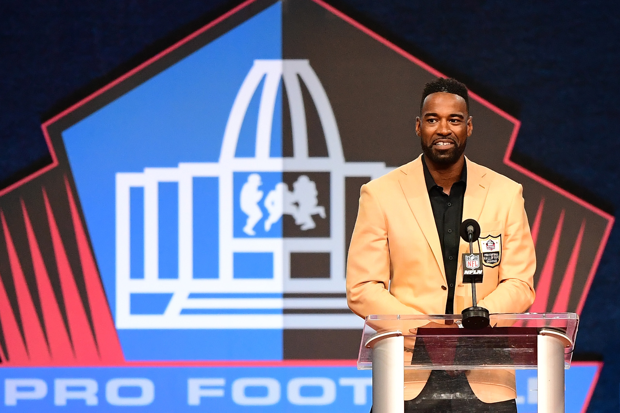 CANTON, OHIO - AUGUST 08: Calvin Johnson speaks during the NFL Hall of Fame Enshrinement Ceremony at Tom Benson Hall Of Fame Stadium on August 08, 2021 in Canton, Ohio. (Photo by Emilee Chinn/Getty Images)