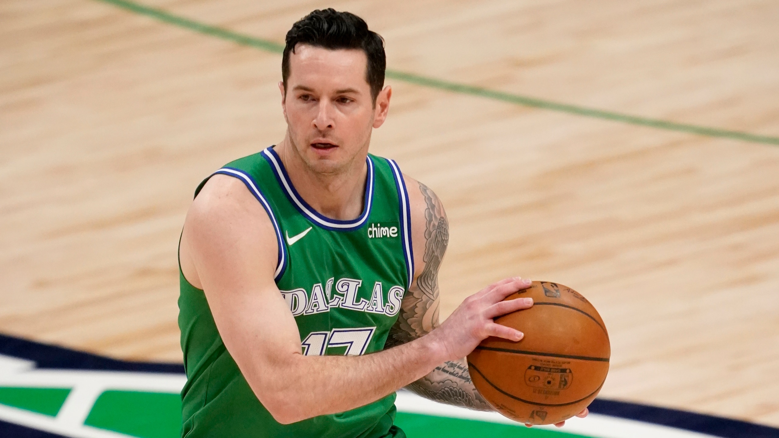 Dallas Mavericks' JJ Redick makes a pass during an NBA basketball game against the Sacramento Kings in Dallas, Sunday, May 2, 2021. (AP Photo/Tony Gutierrez)