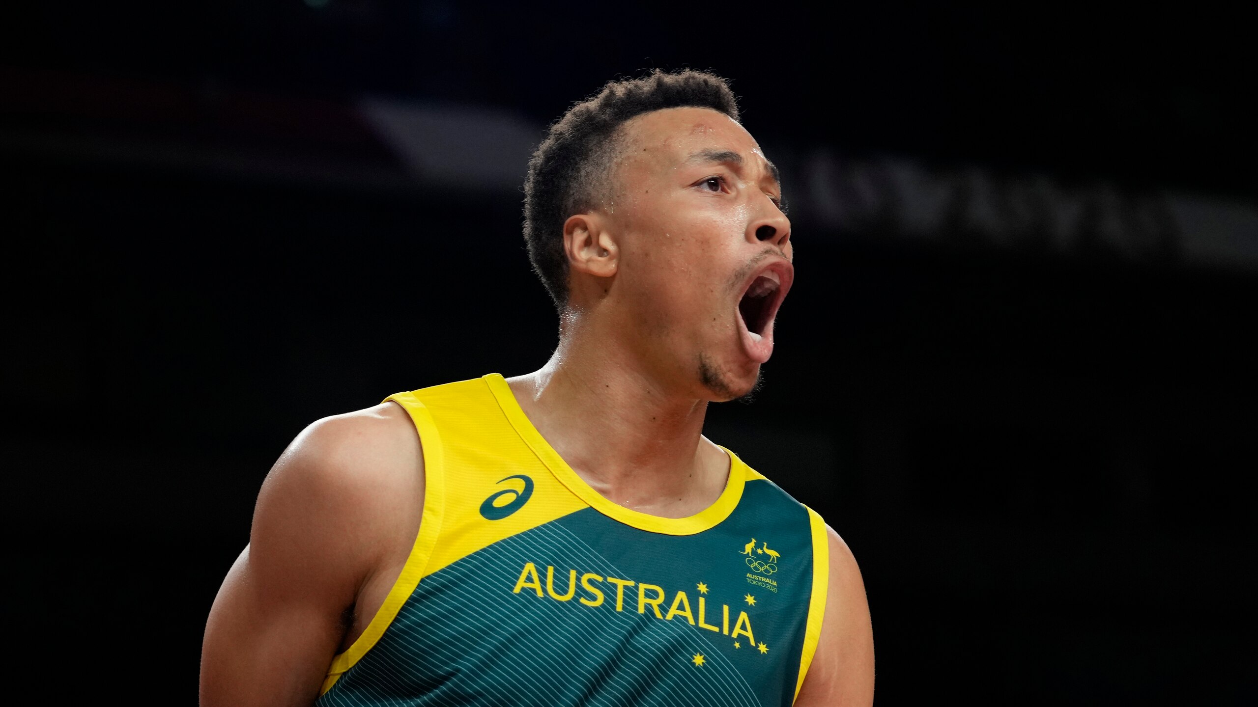 Australia's Dante Exum (11) celebrates after a score during men's basketball semifinal game against the United States at the 2020 Summer Olympics, Thursday, Aug. 5, 2021, in Saitama, Japan. (AP Photo/Eric Gay) Australia's Dante Exum (11) celebrates after a score during men's basketball semifinal game against the United States at the 2020 Summer Olympics, Thursday, Aug. 5, 2021, in Saitama, Japan. (AP Photo/Eric Gay)