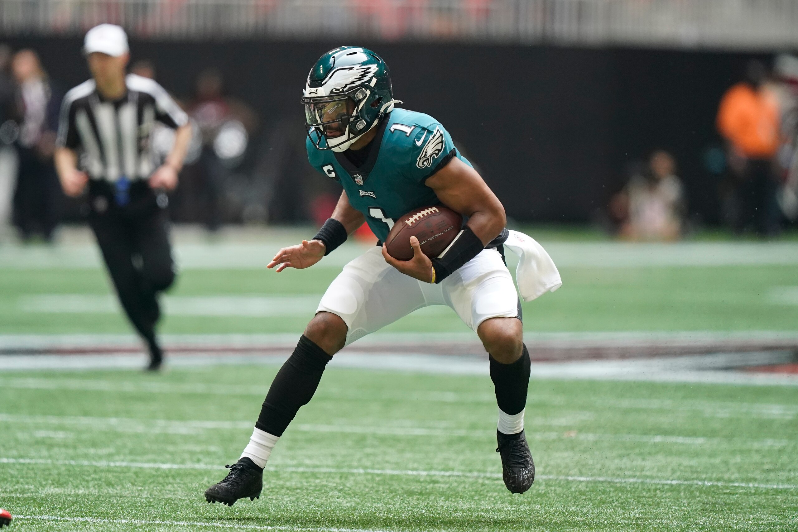 Philadelphia Eagles quarterback Jalen Hurts (1) runs against the Atlanta Falcons during the second half of an NFL football game, Sunday, Sept. 12, 2021, in Atlanta. The Philadelphia Eagles won 32-6. (AP Photo/Brynn Anderson)