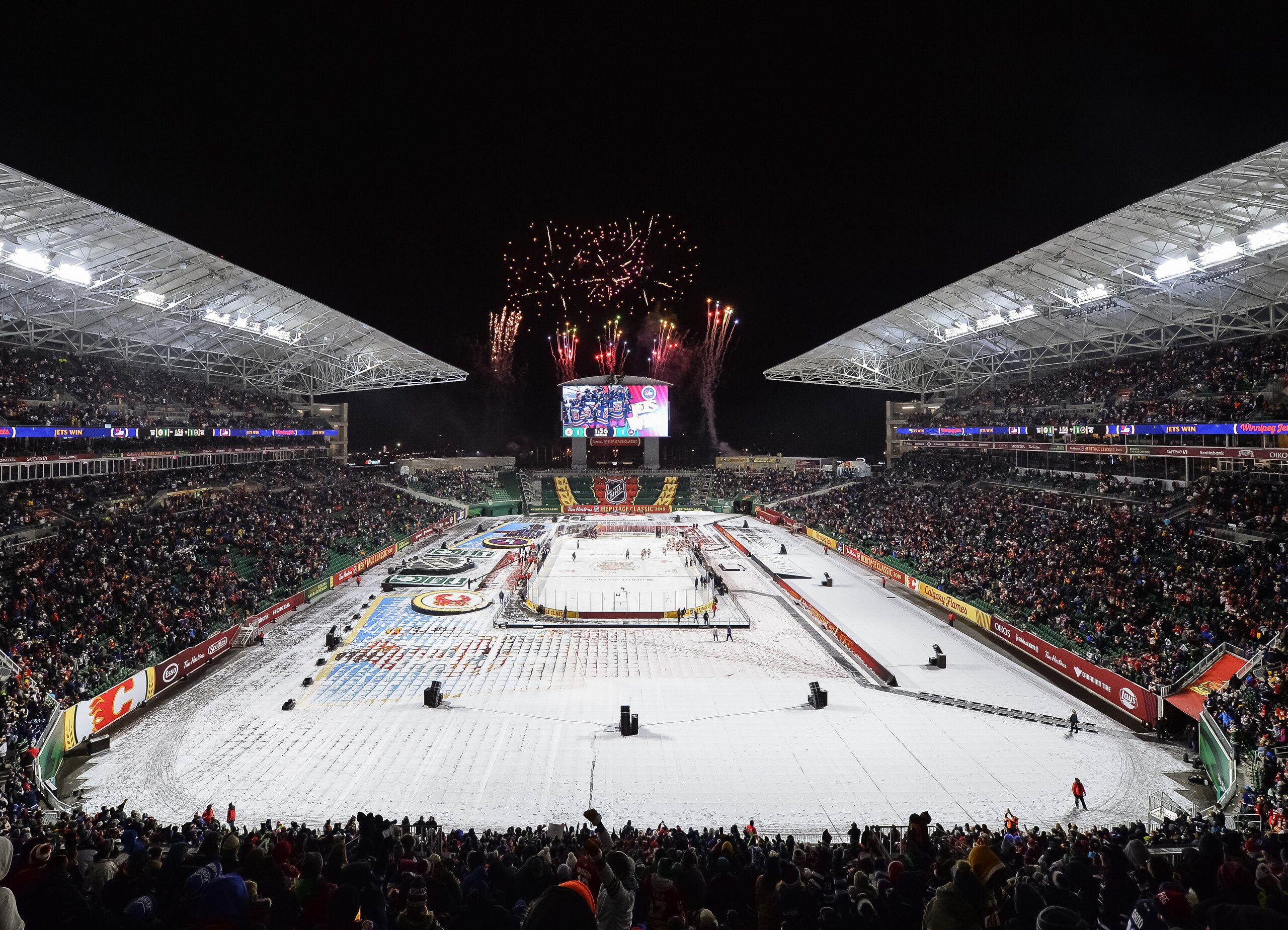 REGINA, SK - OCTOBER 26: Fireworks go off as the Winnipeg Jets win 2-1 over the Calgary Flames during the 2019 Tim Hortons NHL Heritage Classic at Mosaic Stadium on October 26, 2019 in Regina, Saskatchewan, Canada.   (Photo by Minas Panagiotakis/NHLI via Getty Images)