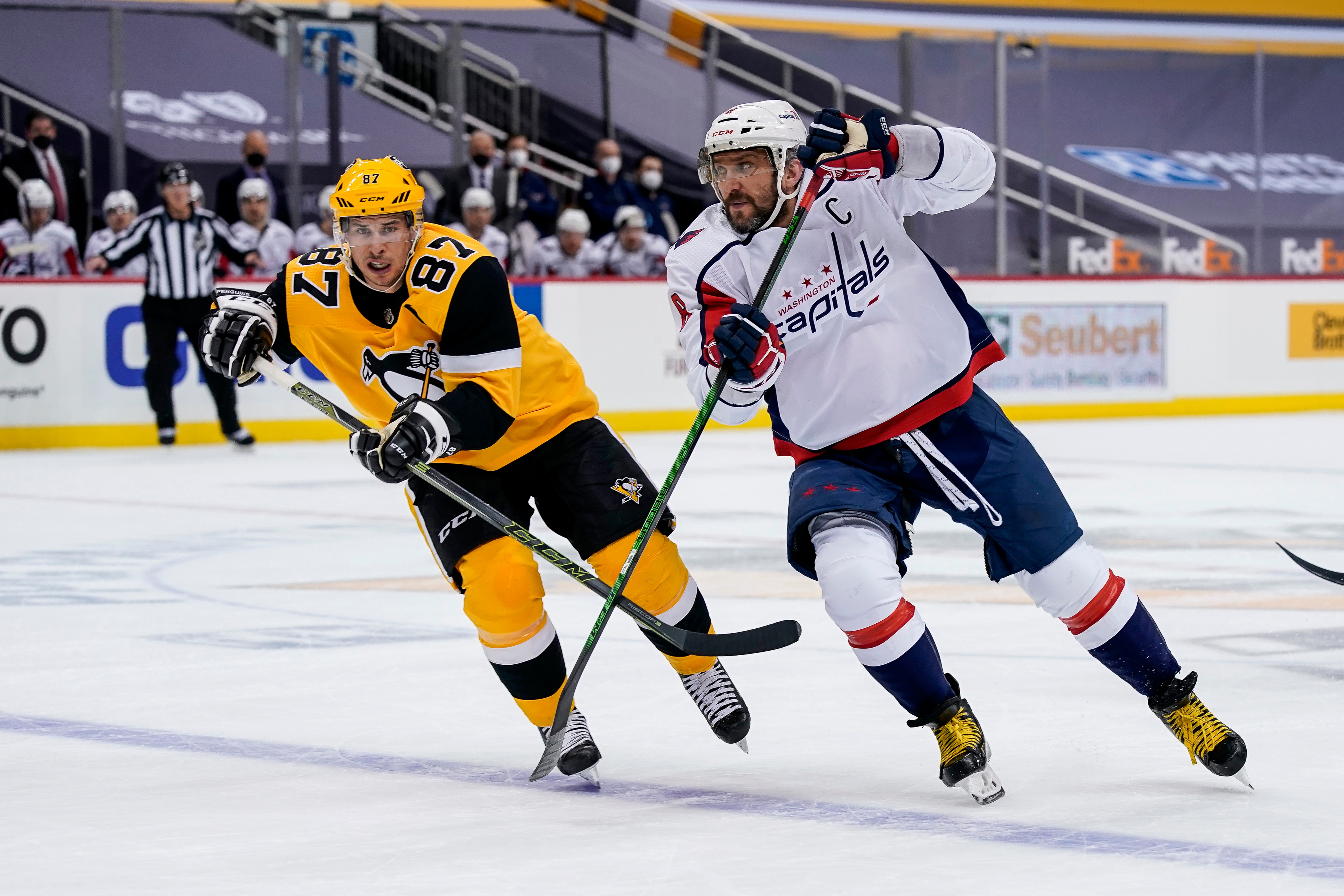 PITTSBURGH, PA - FEBRUARY 16: Pittsburgh Penguins Center Sidney Crosby (87) and Washington Capitals Left Wing Alex Ovechkin (8) skate during the first period in the NHL game between the Pittsburgh Penguins and the Washington Capitals on February 16, 2021, at PPG Paints Arena in Pittsburgh, PA. (Photo by Jeanine Leech/Icon Sportswire via Getty Images)