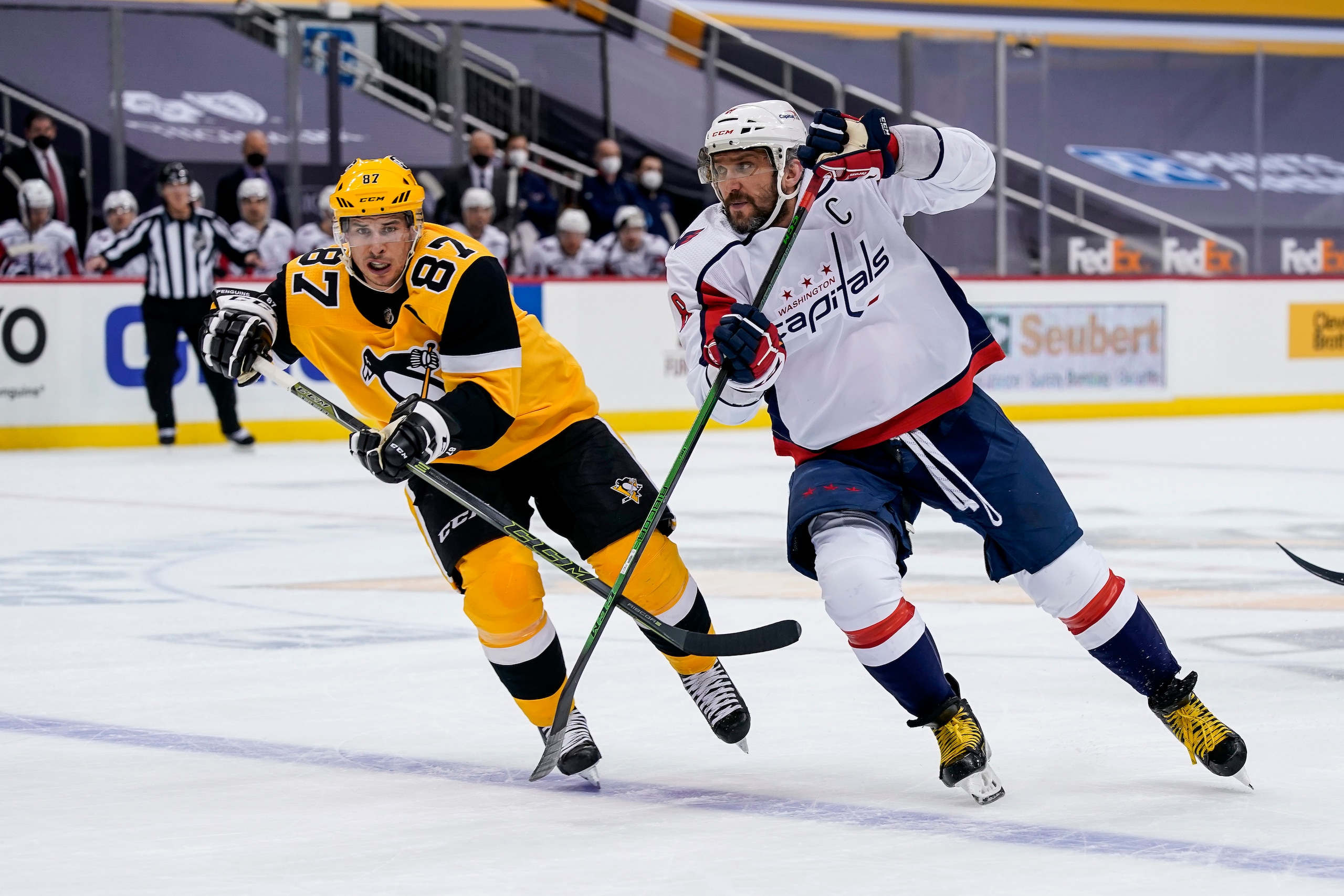 PITTSBURGH, PA - FEBRUARY 16: Pittsburgh Penguins Center Sidney Crosby (87) and Washington Capitals Left Wing Alex Ovechkin (8) skate during the first period in the NHL game between the Pittsburgh Penguins and the Washington Capitals on February 16, 2021, at PPG Paints Arena in Pittsburgh, PA. (Photo by Jeanine Leech/Icon Sportswire via Getty Images)