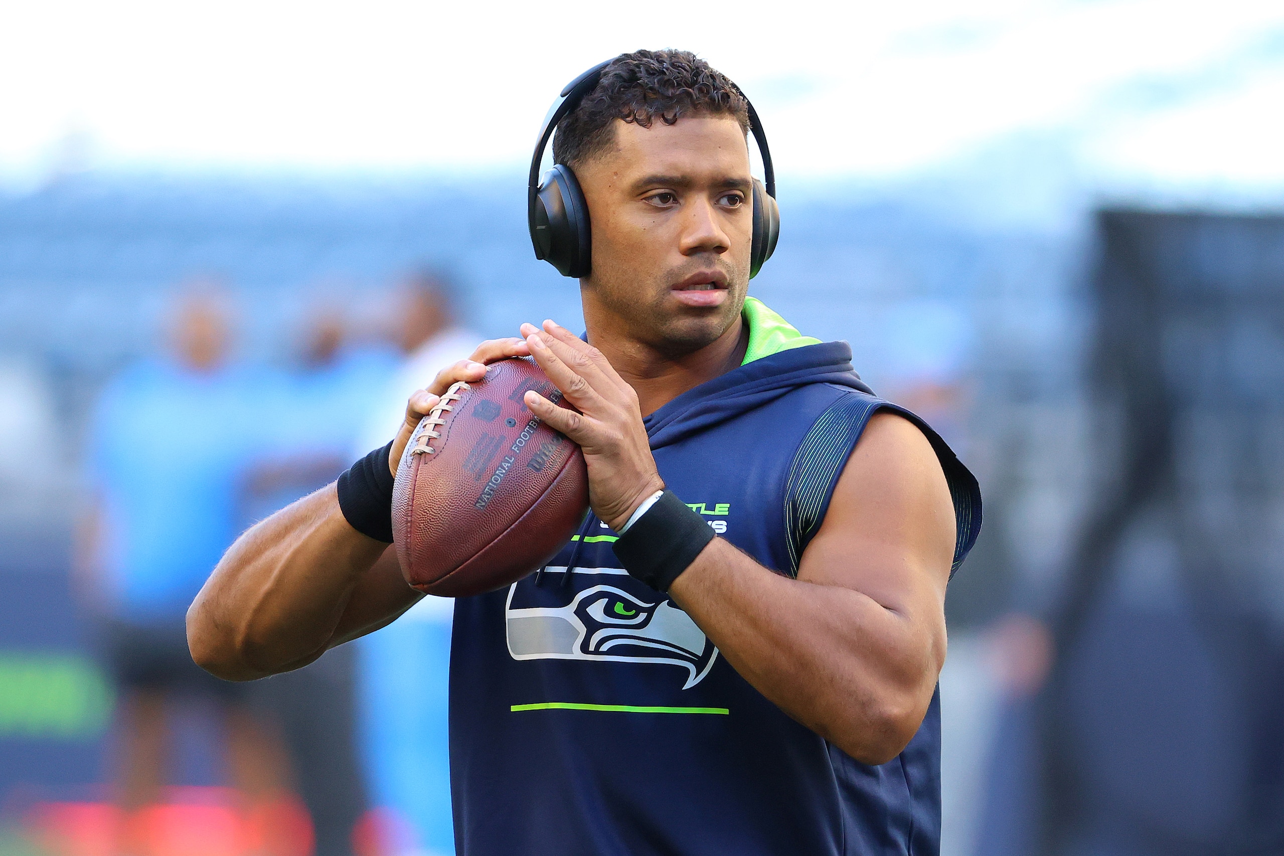 SEATTLE, WASHINGTON - AUGUST 28: Russell Wilson #3 of the Seattle Seahawks warms up before the NFL preseason game against the Los Angeles Chargers at Lumen Field on August 28, 2021 in Seattle, Washington. (Photo by Abbie Parr/Getty Images)