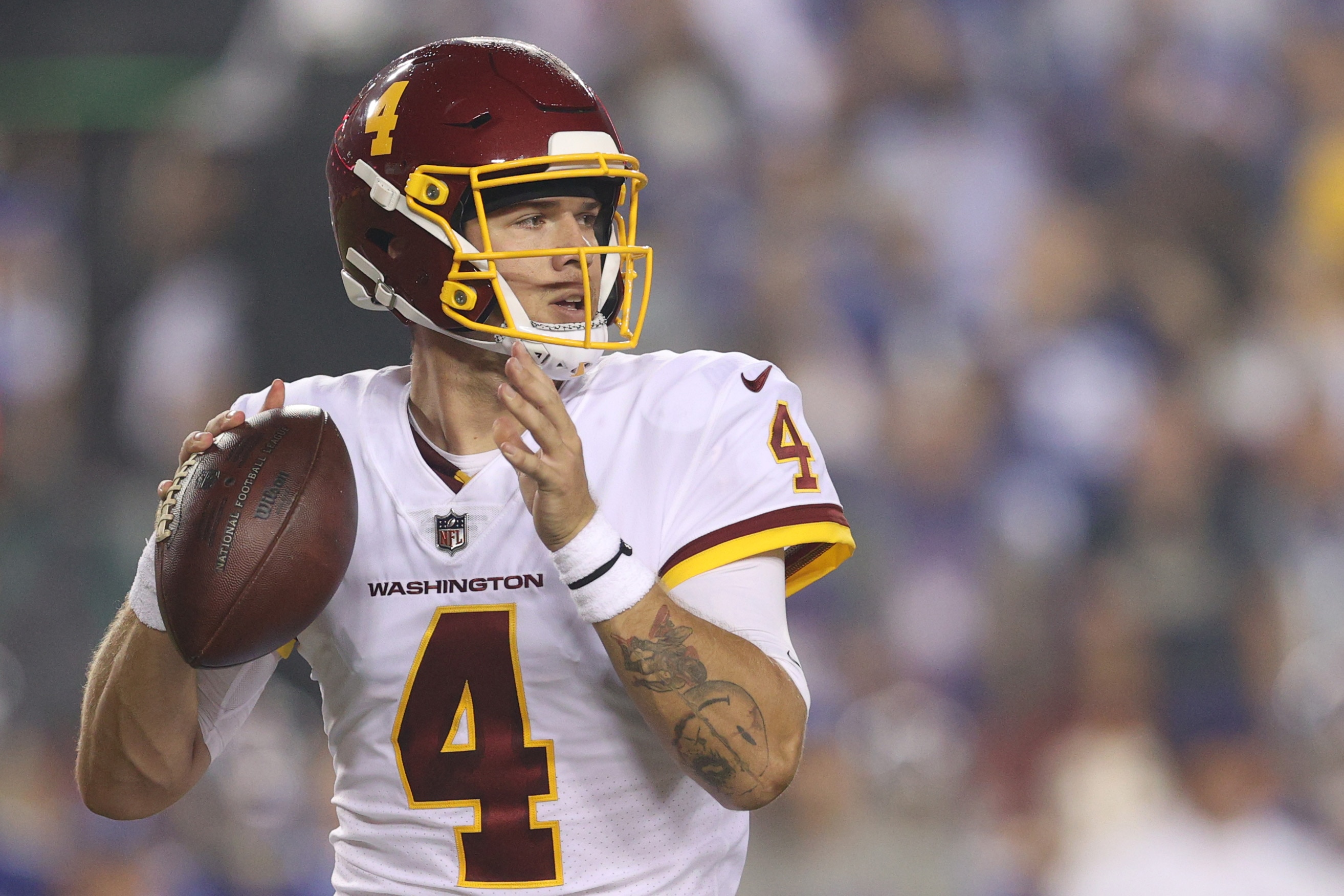LANDOVER, MARYLAND - SEPTEMBER 16: Taylor Heinicke #4 of the Washington Football Team looks to pass during the first quarter against the New York Giants at FedExField on September 16, 2021 in Landover, Maryland. (Photo by Patrick Smith/Getty Images)
