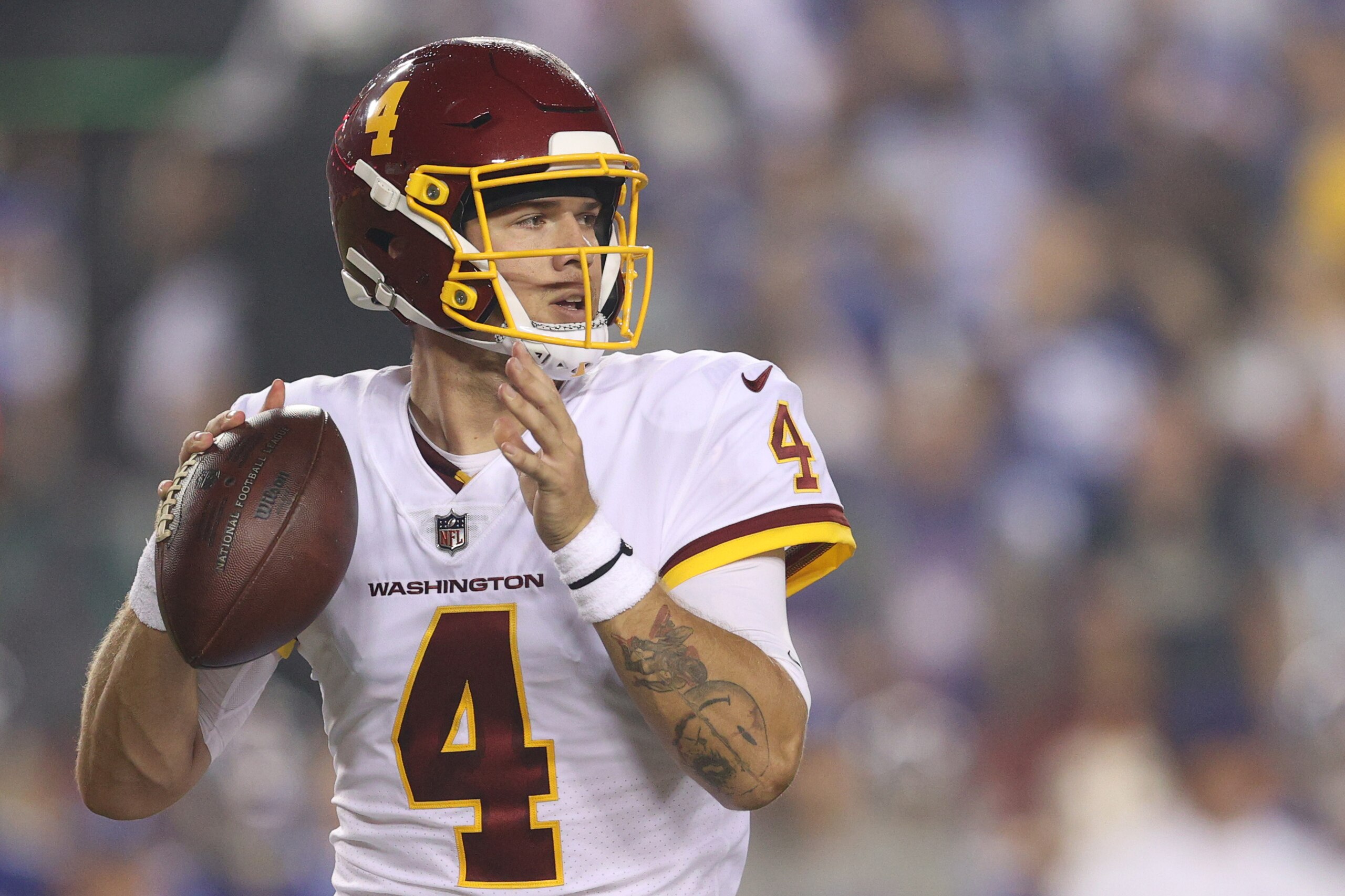 LANDOVER, MARYLAND - SEPTEMBER 16: Taylor Heinicke #4 of the Washington Football Team looks to pass during the first quarter against the New York Giants at FedExField on September 16, 2021 in Landover, Maryland. (Photo by Patrick Smith/Getty Images)