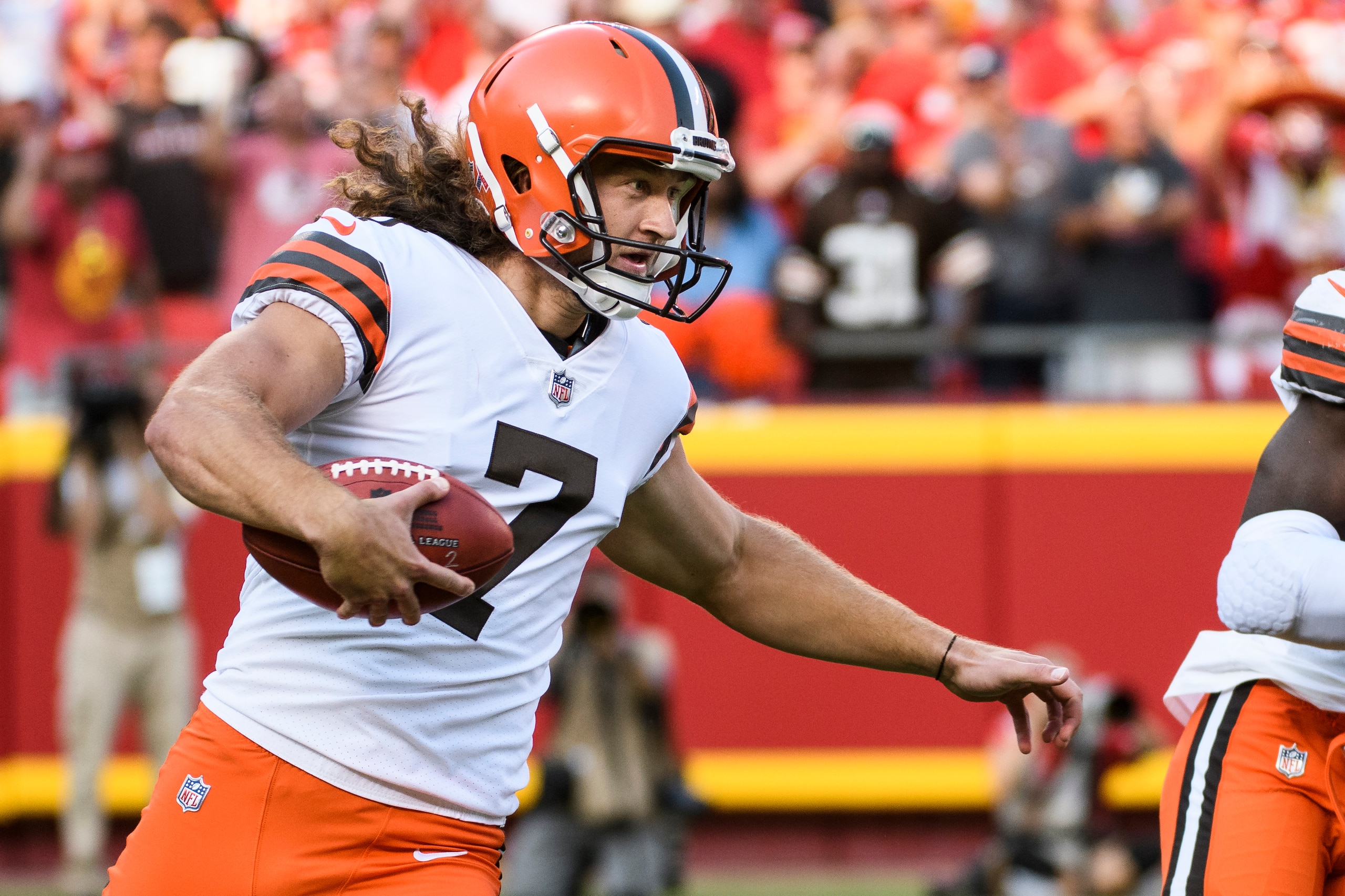 Cleveland Browns punter Jamie Gillan runs the ball after a fumbled snap during the second half of an NFL football game against the Kansas City Chiefs, Sunday, Sept.12, 2021 in Kansas City, Mo. (AP Photo/Reed Hoffmann)