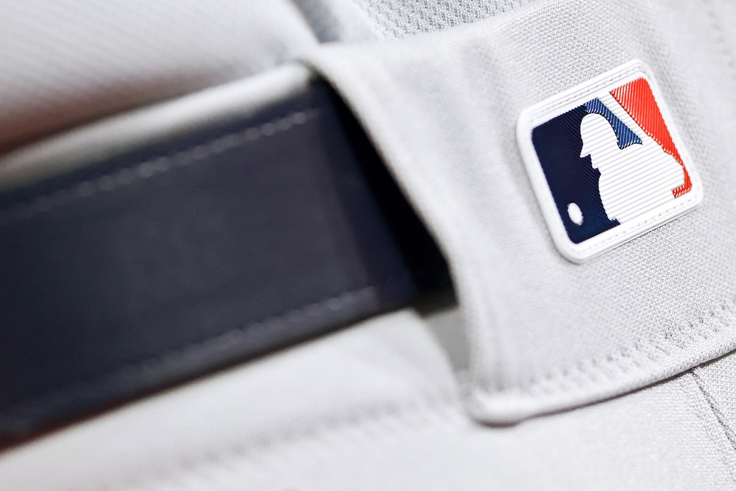 CINCINNATI, OHIO - AUGUST 30: A detail view of a MLB logo during the game between the St. Louis Cardinals and Cincinnati Reds at Great American Ball Park on August 30, 2021 in Cincinnati, Ohio. (Photo by Dylan Buell/Getty Images)