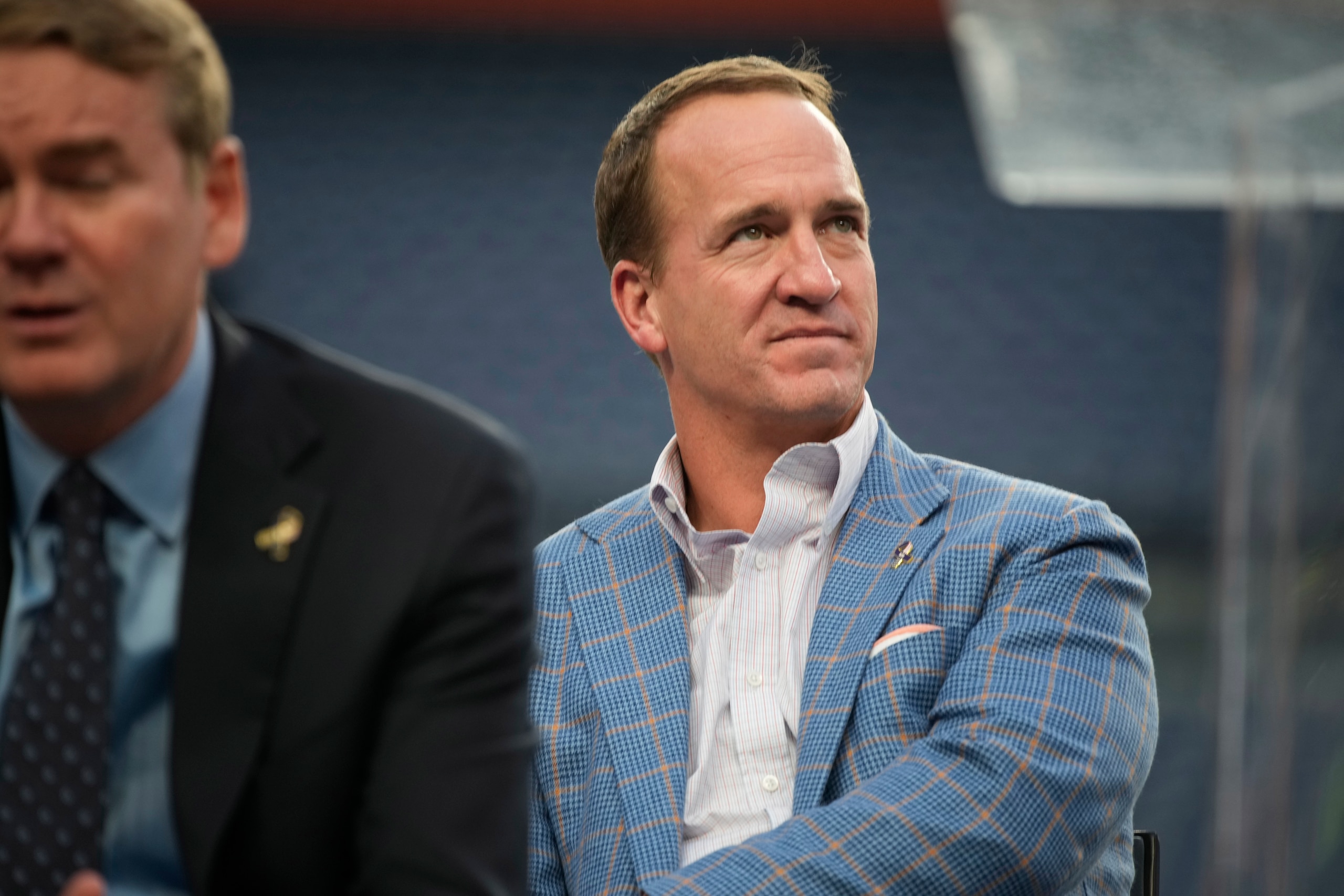 Retired NFL quarterback Peyton Manning waits to speak to mark the 20th anniversary of the attack on the United States on Sept. 11, 2001, during a memorial service Wednesday, Sept. 1, 2021, in Empower Field at Mile High in Denver. (AP Photo/David Zalubowski) Retired NFL quarterback Peyton Manning waits to speak to mark the 20th anniversary of the attack on the United States on Sept. 11, 2001, during a memorial service Wednesday, Sept. 1, 2021, in Empower Field at Mile High in Denver. (AP Photo/David Zalubowski)