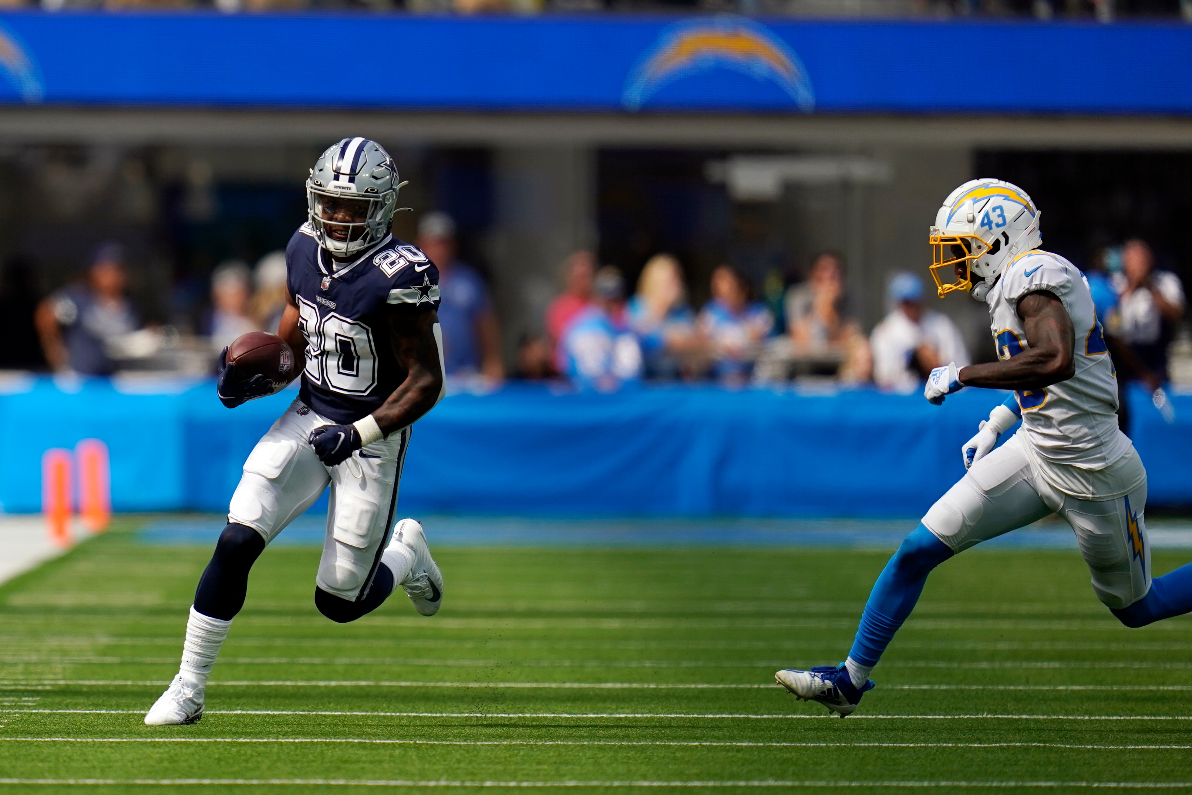 Dallas Cowboys running back Tony Pollard runs against the Los Angeles Chargers during the first half of an NFL football game Sunday, Sept. 19, 2021, in Inglewood, Calif. (AP Photo/Gregory Bull)