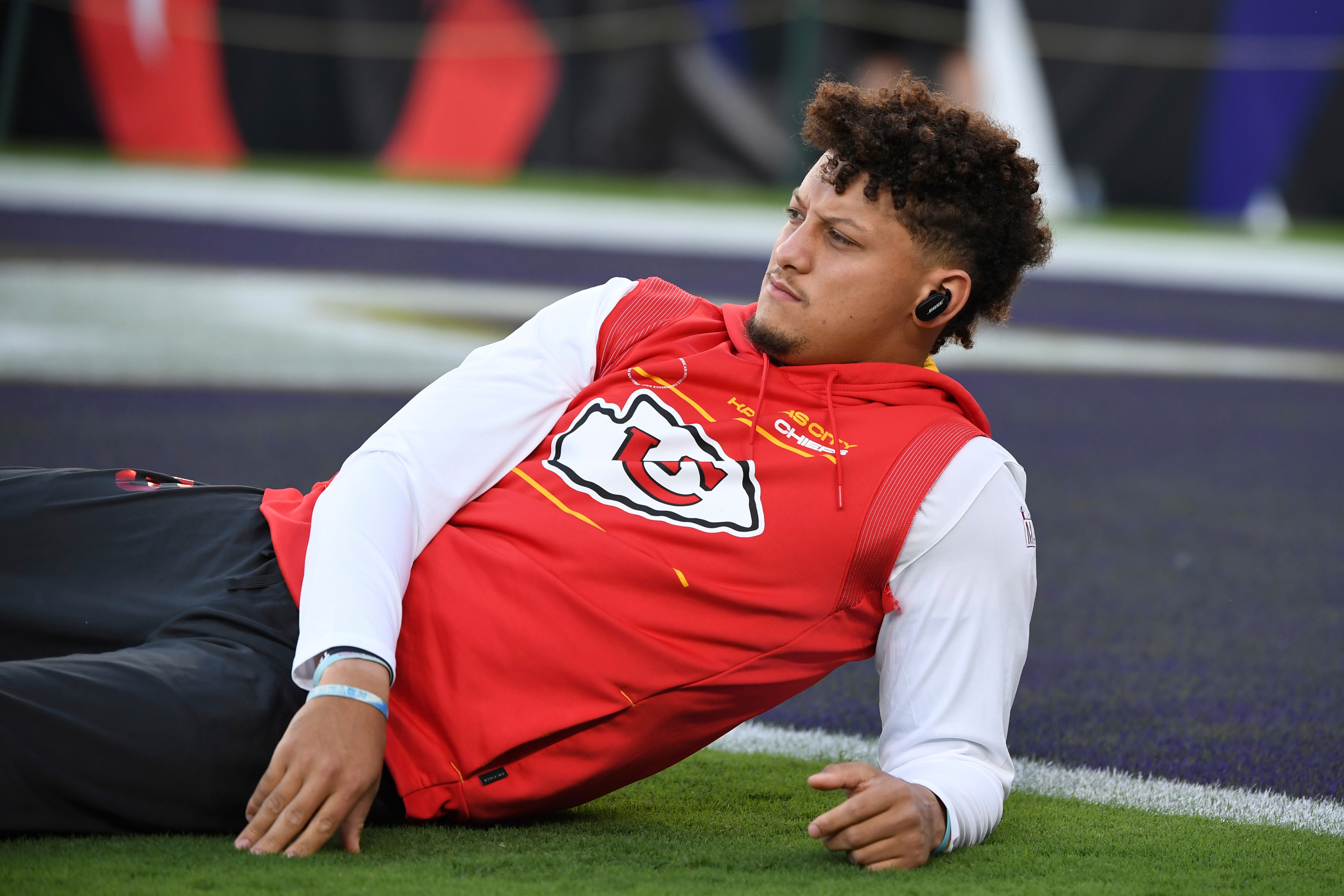 Kansas City Chiefs quarterback Patrick Mahomes stretches during pre-game warm-ups before an NFL football game against the Baltimore Ravens, Sunday, Sept. 19, 2021, in Baltimore. (AP Photo/Terrance Williams)