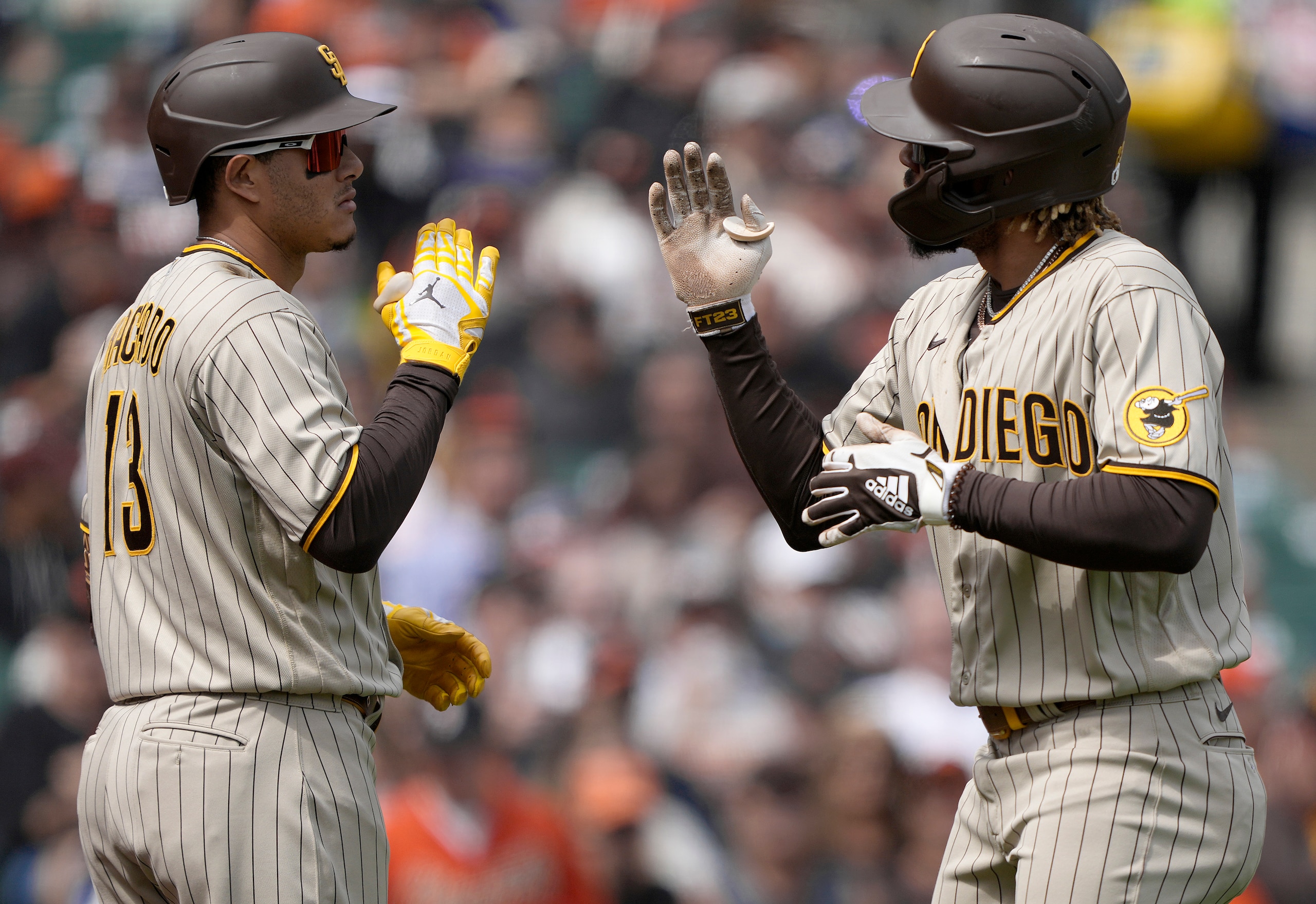 SAN FRANCISCO, CALIFORNIA - SEPTEMBER 16: Fernando Tatis Jr. #23 of the San Diego Padres is congratulated by Manny Machado #13 after Tatis hit a solo home run against the San Francisco Giants in the top of the third inning at Oracle Park on September 16, 2021 in San Francisco, California. (Photo by Thearon W. Henderson/Getty Images)