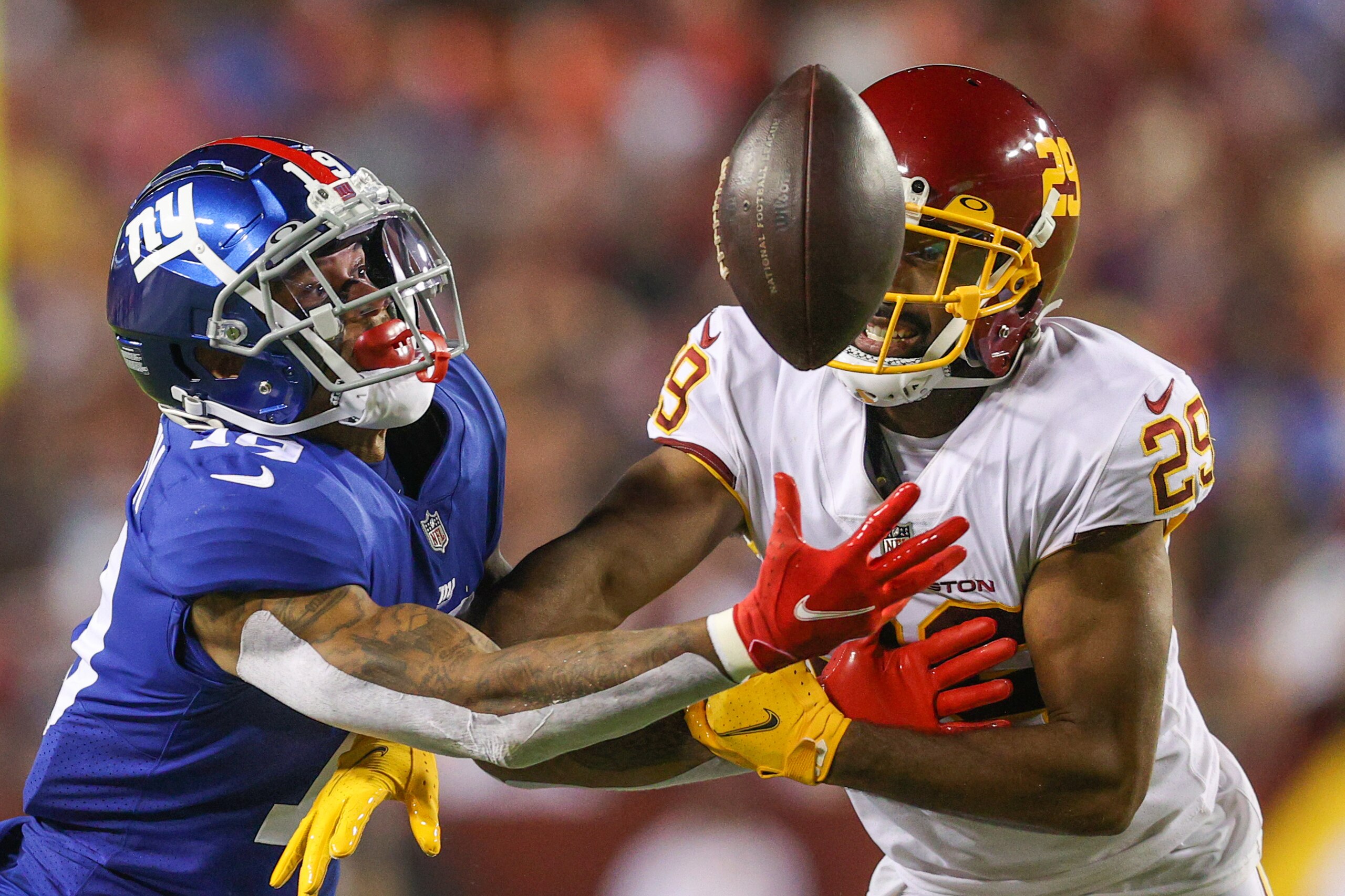 LANDOVER, MARYLAND - SEPTEMBER 16: Kendall Fuller #29 of the Washington Football Team and Kenny Golladay #19 of the New York Giants unable to gain control of the ball during the third quarter at FedExField on September 16, 2021 in Landover, Maryland. (Photo by Patrick Smith/Getty Images)