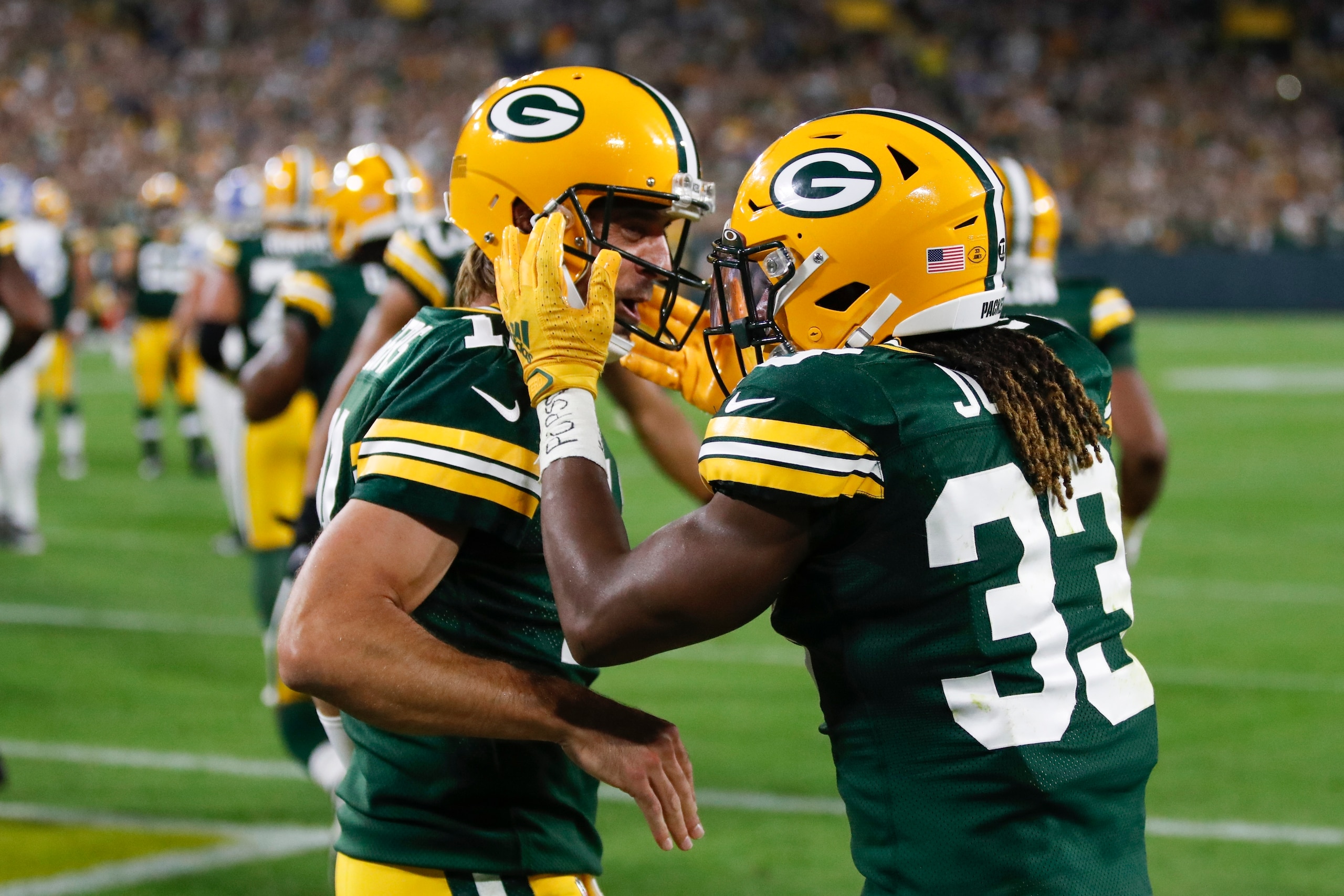 Green Bay Packers' Aaron Jones is congratulated by Aaron Rodgers after running for a touchdown during the first half of an NFL football game against the Detroit Lions Monday, Sept. 20, 2021, in Green Bay, Wis. (AP Photo/Matt Ludtke) Green Bay Packers' Aaron Jones is congratulated by Aaron Rodgers after running for a touchdown during the first half of an NFL football game against the Detroit Lions Monday, Sept. 20, 2021, in Green Bay, Wis. (AP Photo/Matt Ludtke)
