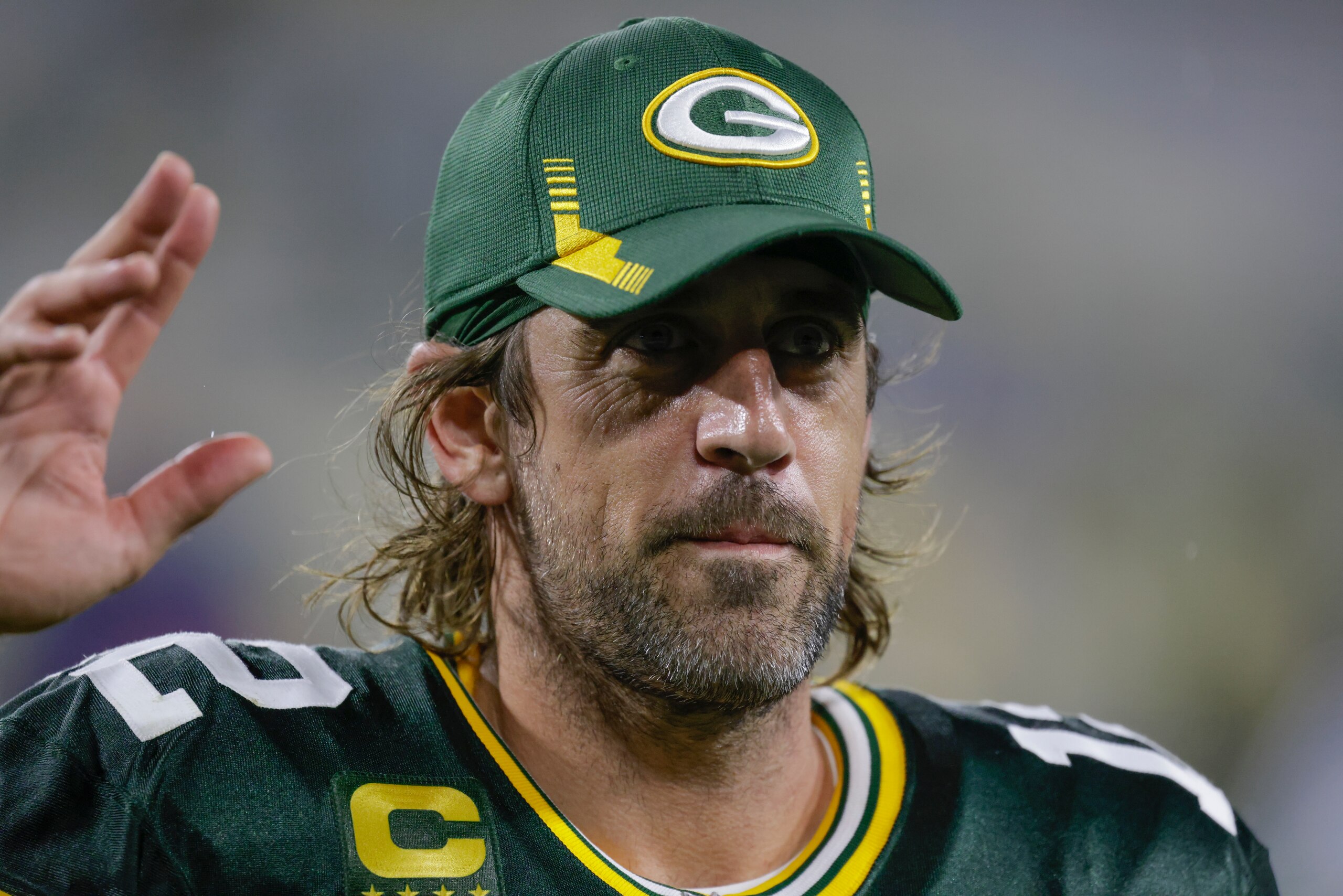 Green Bay Packers' Aaron Rodgers waves to fans as he leaves the field after an NFL football game against the Detroit Lions Monday, Sept. 20, 2021, in Green Bay, Wis. The Packers won 35-17. (AP Photo/Matt Ludtke)