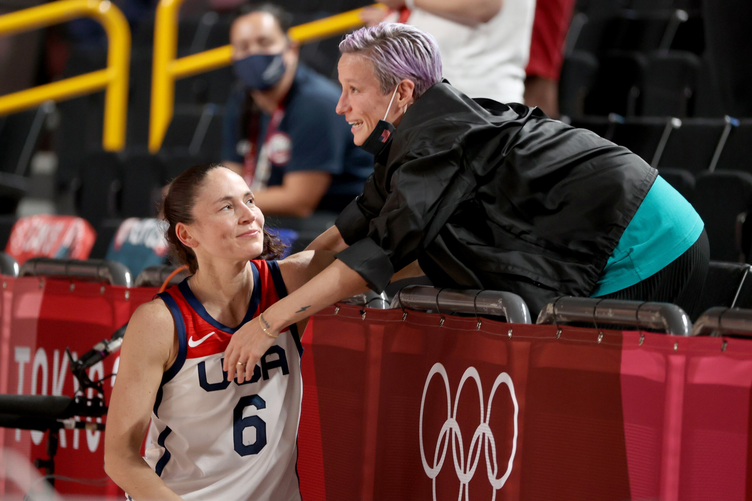 SAITAMA, JAPAN - AUGUST 08: Megan Rapinoe congratulates Sue Bird #6 of Team United States after the United States' win over Japan in the Women's Basketball final game on day sixteen of the 2020 Tokyo Olympic games at Saitama Super Arena on August 08, 2021 in Saitama, Japan. (Photo by Kevin C. Cox/Getty Images) SAITAMA, JAPAN - AUGUST 08: Megan Rapinoe congratulates Sue Bird #6 of Team United States after the United States' win over Japan in the Women's Basketball final game on day sixteen of the 2020 Tokyo Olympic games at Saitama Super Arena on August 08, 2021 in Saitama, Japan. (Photo by Kevin C. Cox/Getty Images)