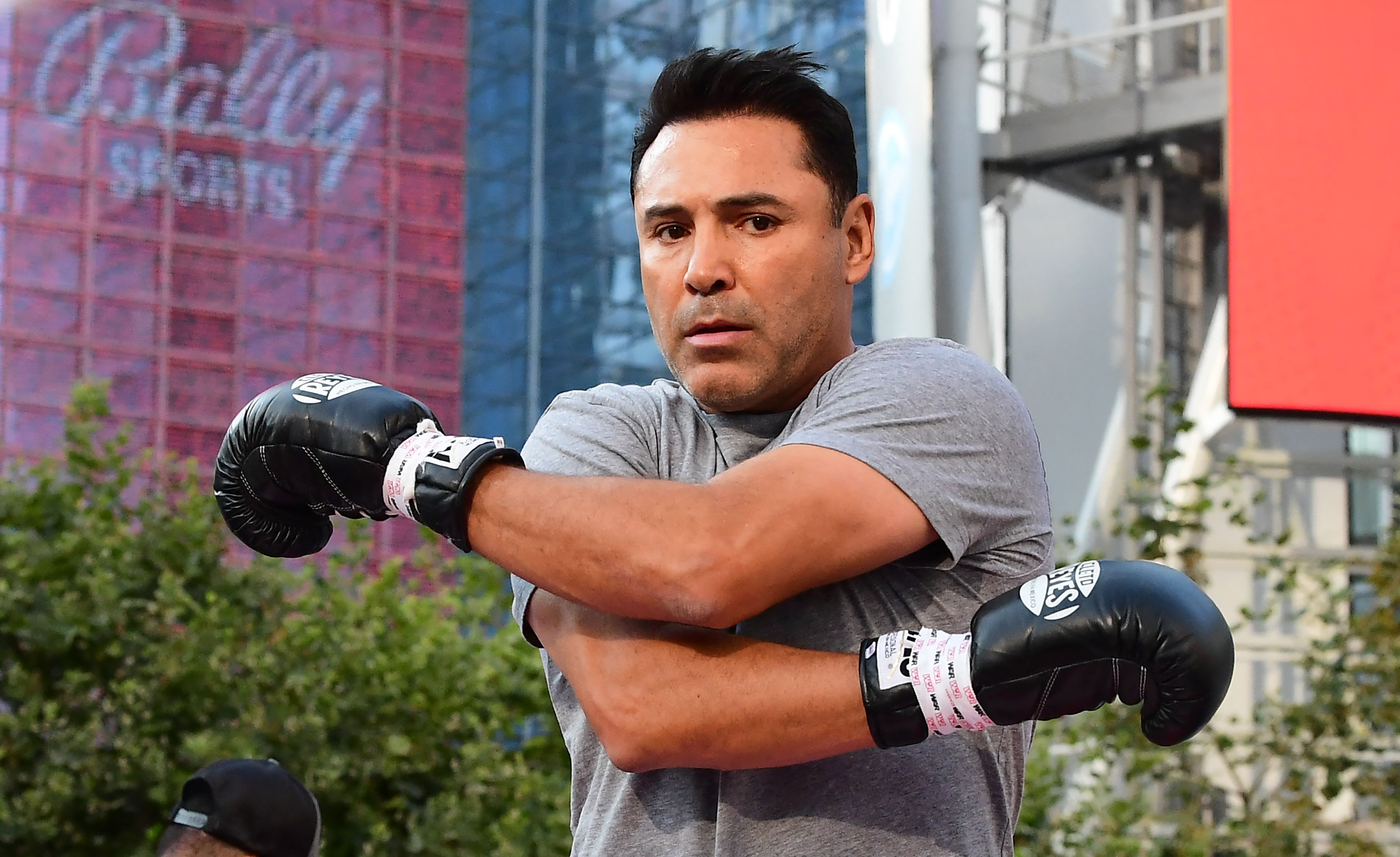 Former US Olympics Gold medalist professional boxer Oscar De La Hoya stretches before sparring with his partner during a media workout in Los Angeles, California on August 24, 2021. - De La Hoya will face former UFC figher Vitor Belfort at Staples Center in Los Angeles on September 11. (Photo by Frederic J. BROWN / AFP) (Photo by FREDERIC J. BROWN/AFP via Getty Images)