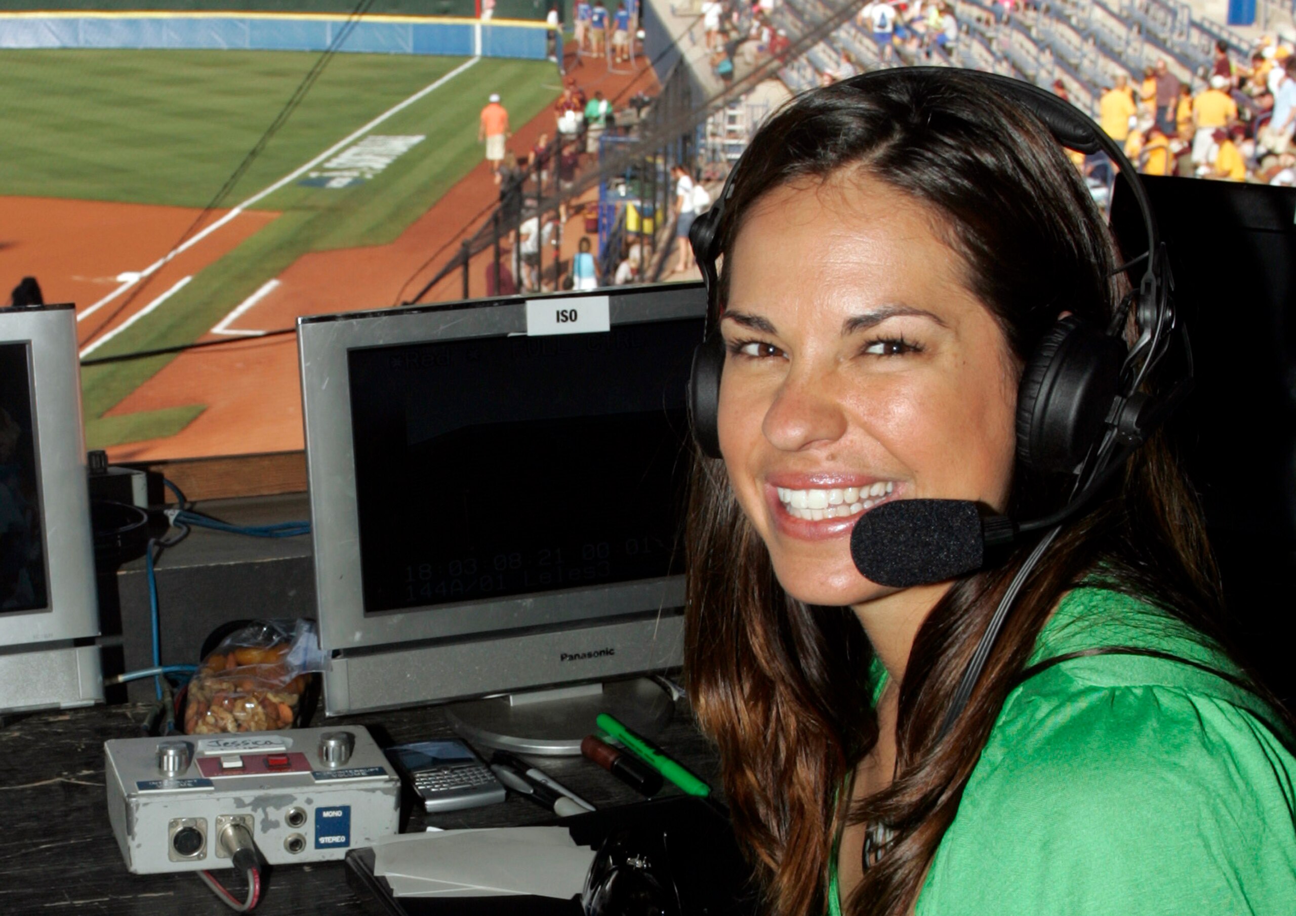 FILE - In this May 29, 2009, file photo, USA softball player Jessica Mendoza poses for a photo in the ESPN broadcast booth at the Women's College World Series in Oklahoma City. ESPN baseball analyst Jessica Mendoza tried to clarify her remarks about the Mike Fiers role in the sign-stealing scandal after criticizing Fiers earlier on a radio show. She said in a statement posted to Twitter that baseball will benefit from the sign stealing being uncovered and that appropriate action was taken. Mendoza's issue remains how it came forward.  (AP Photo/File)