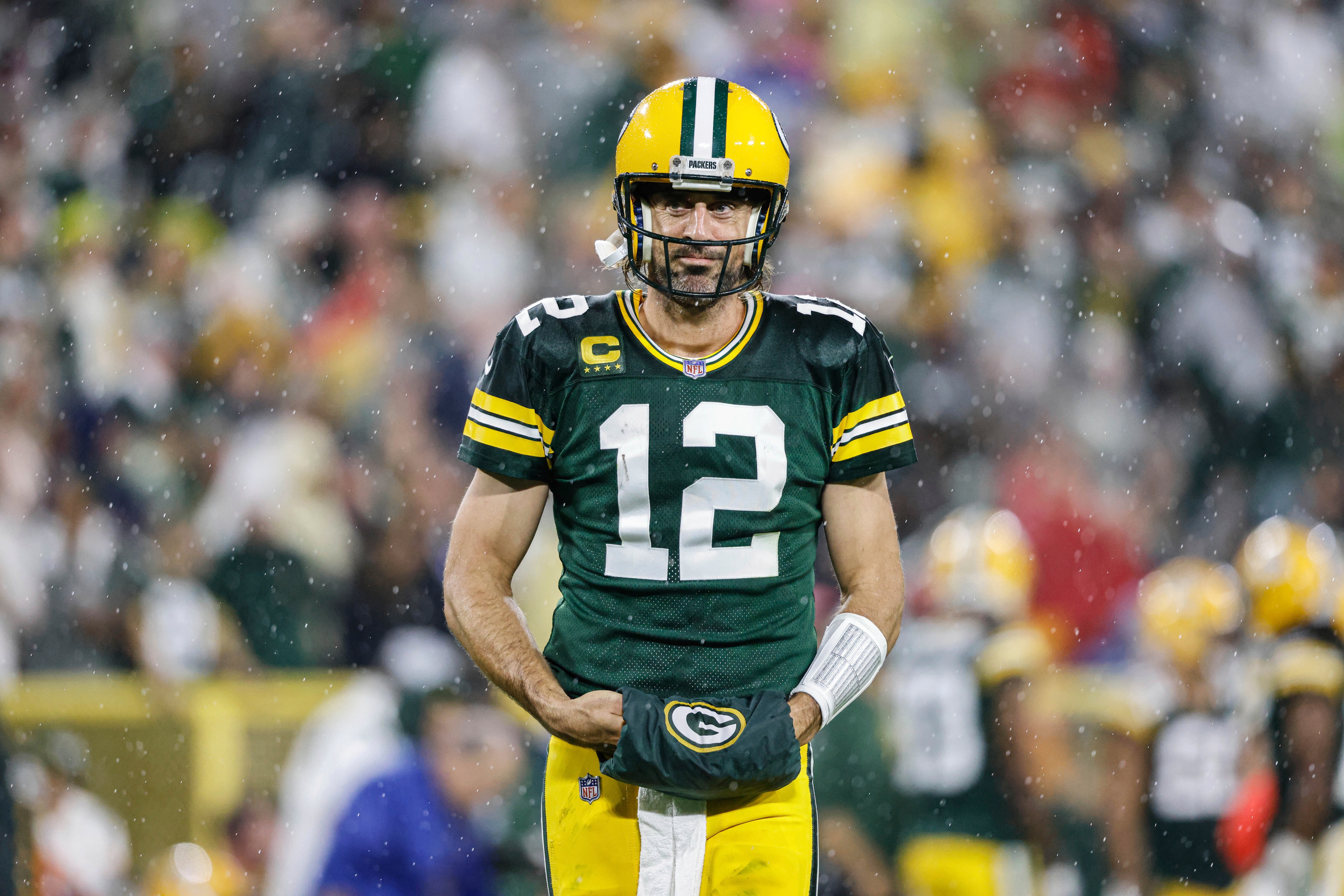 Green Bay Packers quarterback Aaron Rodgers (12) during a timeout against the Detroit Lions during an NFL football game Monday, Sept 20. 2021, in Green Bay, Wis. (AP Photo/Jeffrey Phelps)