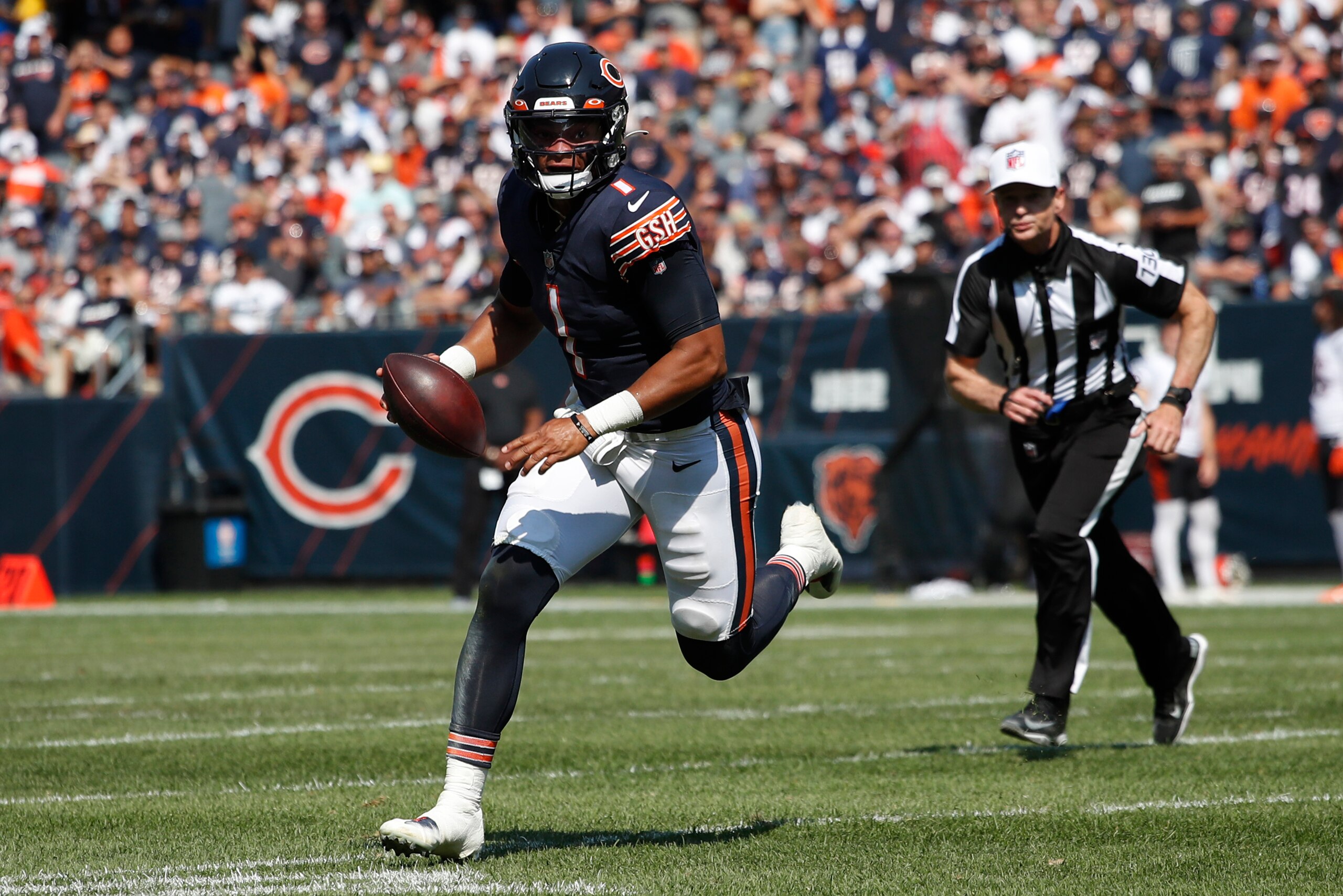 Chicago Bears quarterback Justin Fields (1) runs the ball against the Cincinnati Bengals during an NFL football game Sunday, Sept. 19, 2021, in Chicago. The Bears won 20-17. (Jeff Haynes/AP Images for Panini) Chicago Bears quarterback Justin Fields (1) runs the ball against the Cincinnati Bengals during an NFL football game Sunday, Sept. 19, 2021, in Chicago. The Bears won 20-17. (Jeff Haynes/AP Images for Panini)