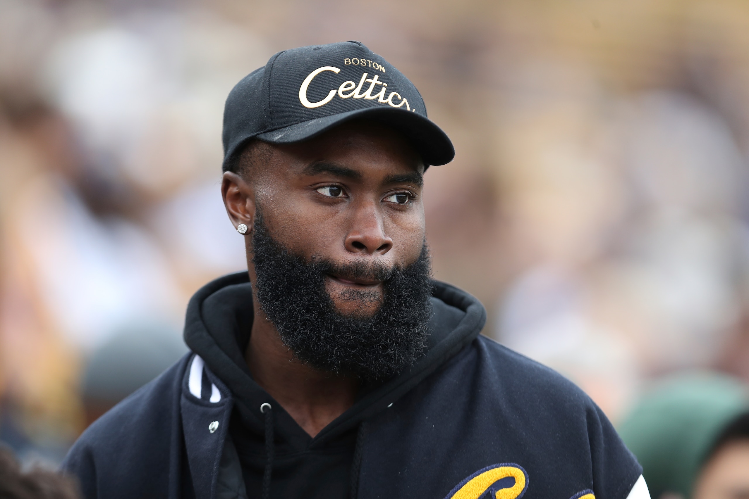 Boston Celtics NBA player Jaylen Brown walks on the sidelines during the California and Sacramento State NCAA college football game on Saturday, Sept. 18, 2021, in Berkeley, Calif. (AP Photo/Jed Jacobsohn)