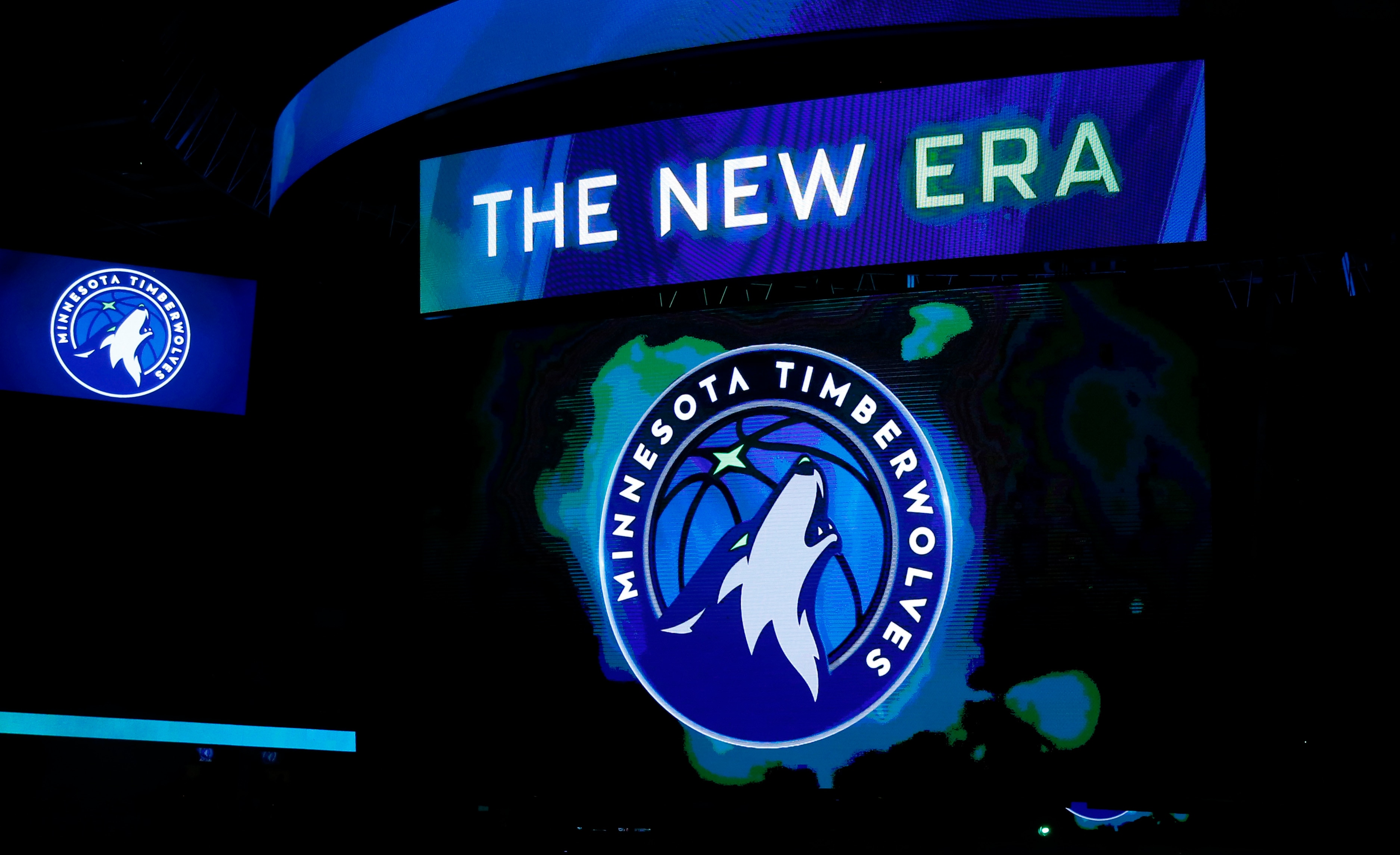 FILE - In this April 11, 2017, file photo, the new Minnesota Timberwolves logo is unveiled on the scoreboard during halftime of the team's NBA basketball game against the Oklahoma City Thunder, in Minneapolis. The Timberwolves are getting into the jersey advertisement game with a Fitbit patch in a three-year deal. The Timberwolves announced the marketing collaboration for the team's first jersey patch on Tuesday, June 20, 2017. (AP Photo/Jim Mone, File)