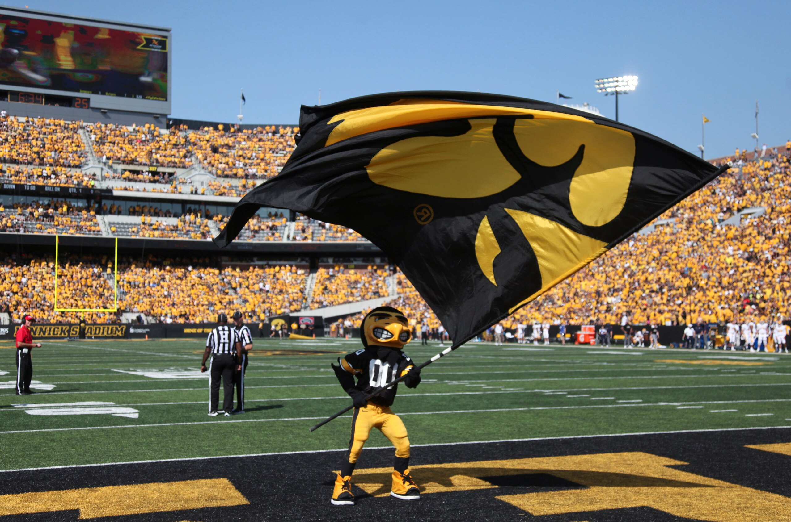 IOWA CITY, IOWA- SEPTEMBER 18:  Mascot Herky the Hawk of the Iowa Hawkeyes waves a flag to celebrate after a touchdown during the first half against the Kent State Golden Flashes at Kinnick Stadium on September 18, 2021 in Iowa City, Iowa.  (Photo by Matthew Holst/Getty Images)