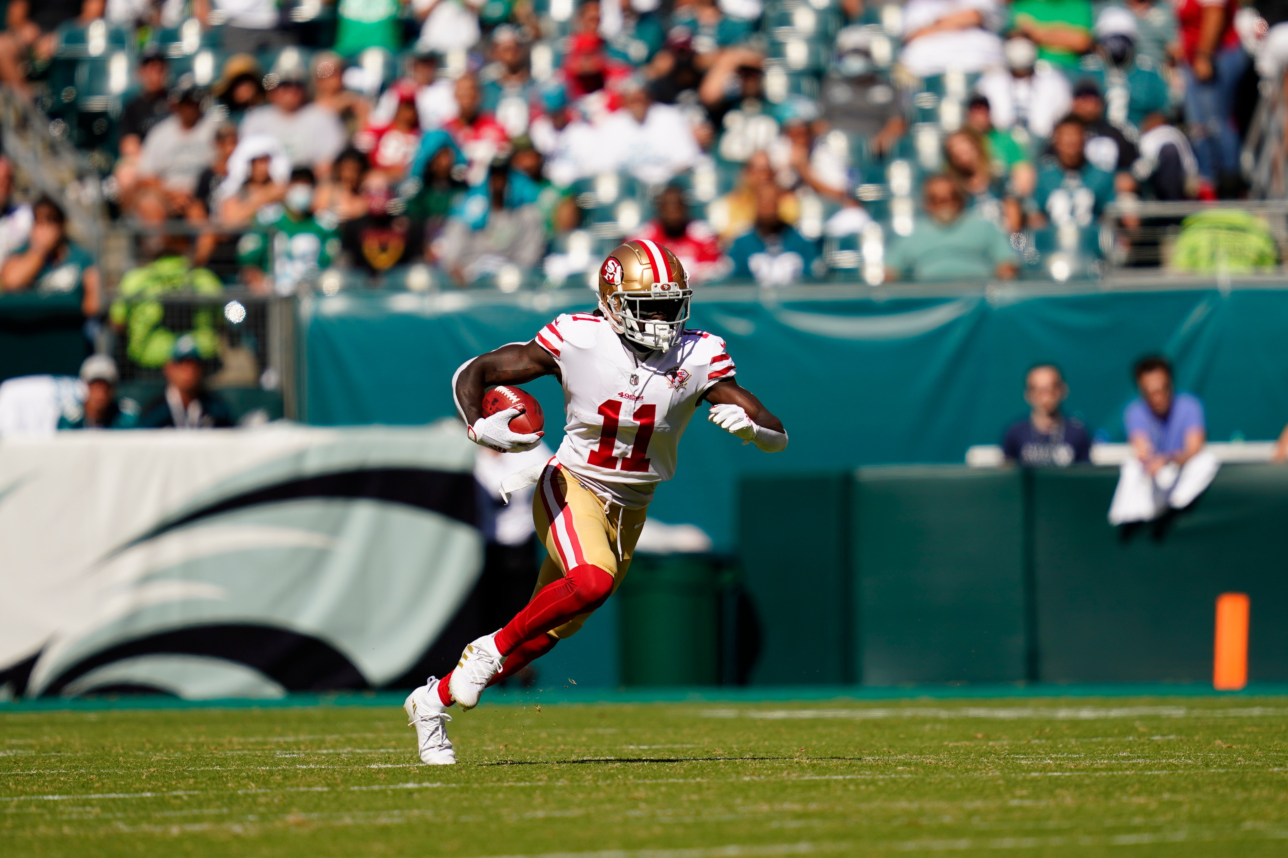 San Francisco 49ers wide receiver Brandon Aiyuk (11) runs with the ball during the second half of an NFL football game against the Philadelphia Eagles on Sunday, Sept. 19, 2021, in Philadelphia. (AP Photo/Matt Slocum)