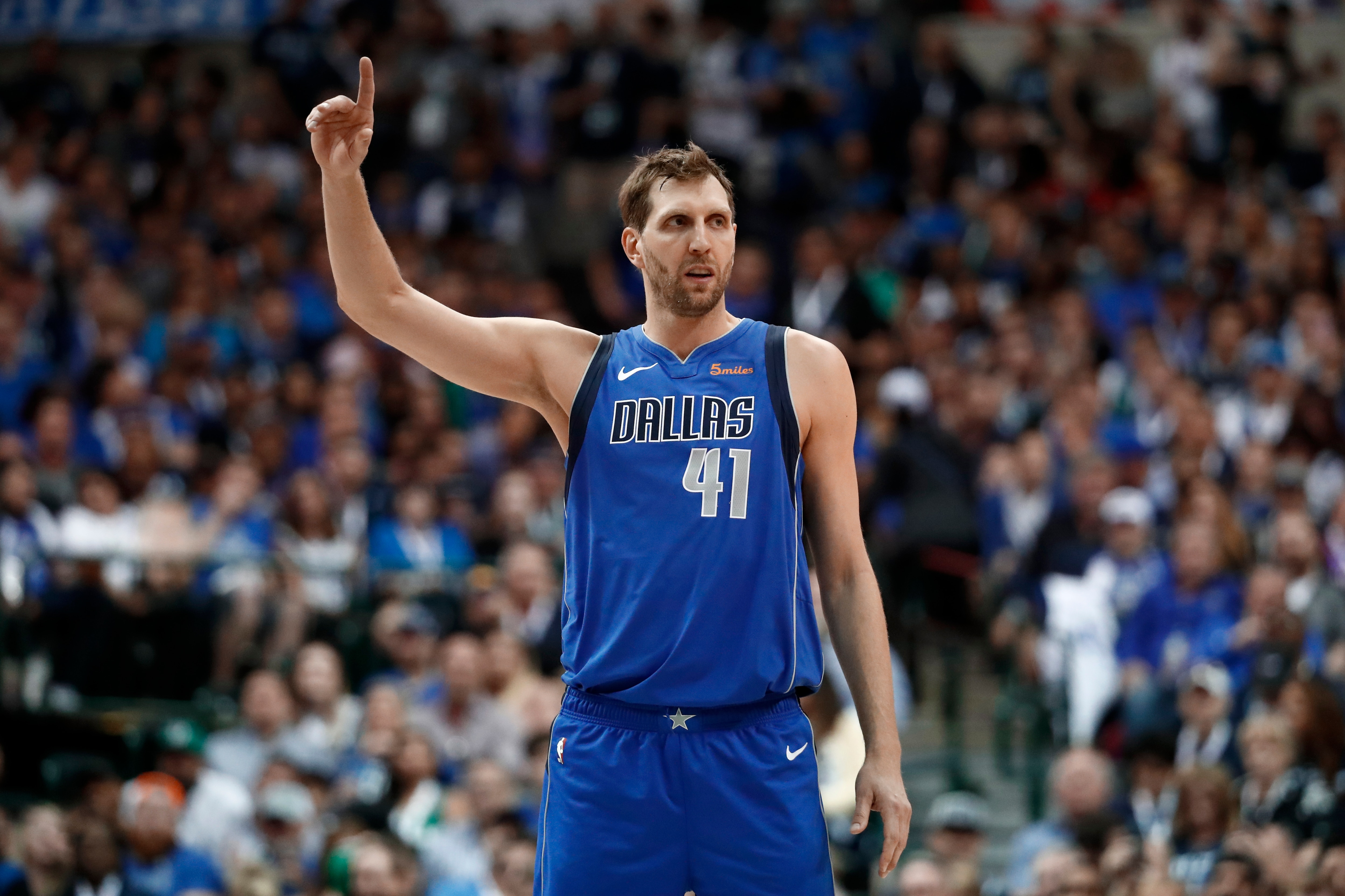 Dallas Mavericks' Dirk Nowitzki stands on the court during an NBA basketball game against the Phoenix Suns in Dallas, Tuesday, April 9, 2019. (AP Photo/Tony Gutierrez)