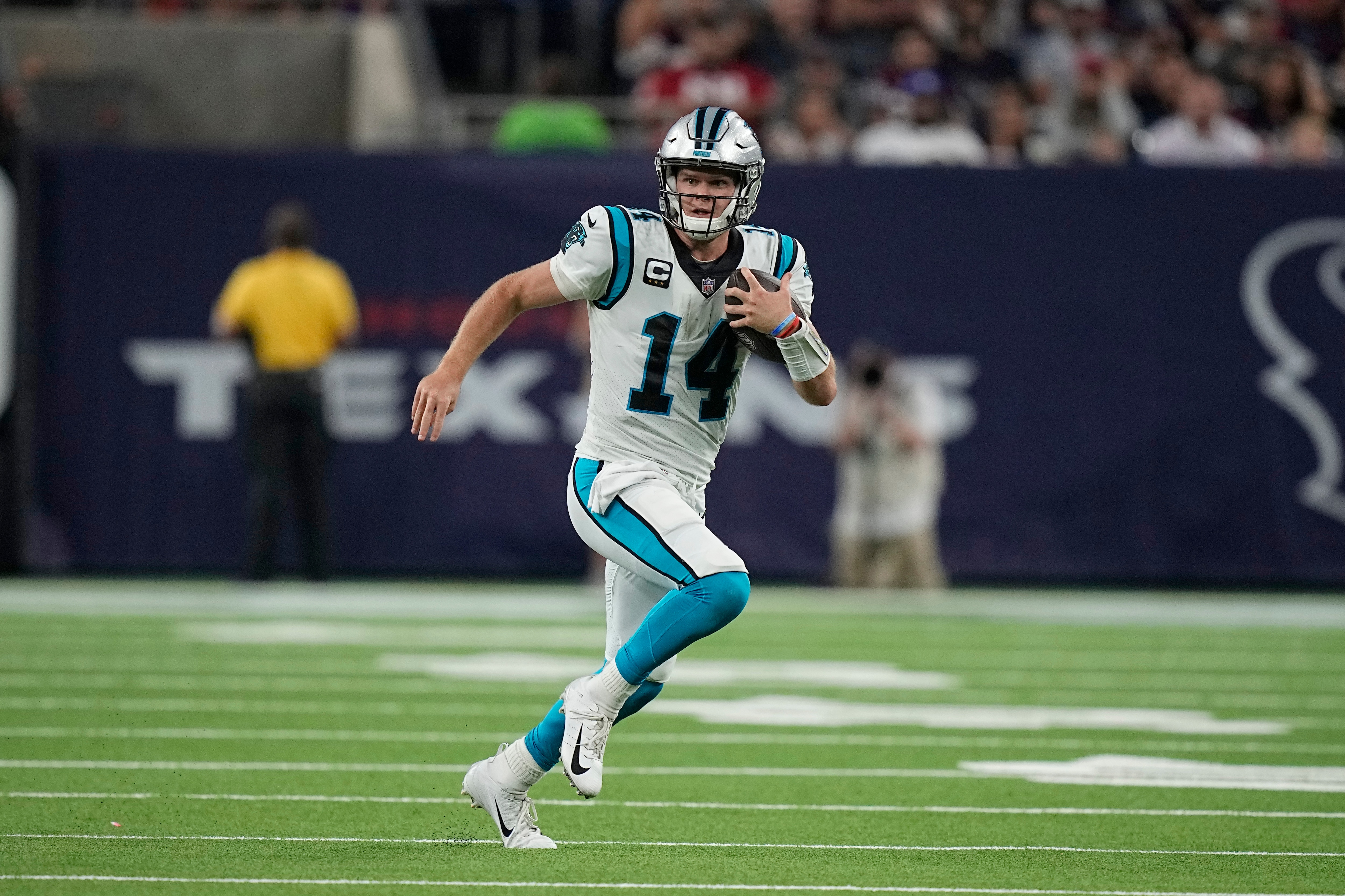 Carolina Panthers quarterback Sam Darnold (14) rushes for a gain against the Houston Texans during the second half of an NFL football game Thursday, Sept. 23, 2021, in Houston. (AP Photo/Eric Christian Smith)