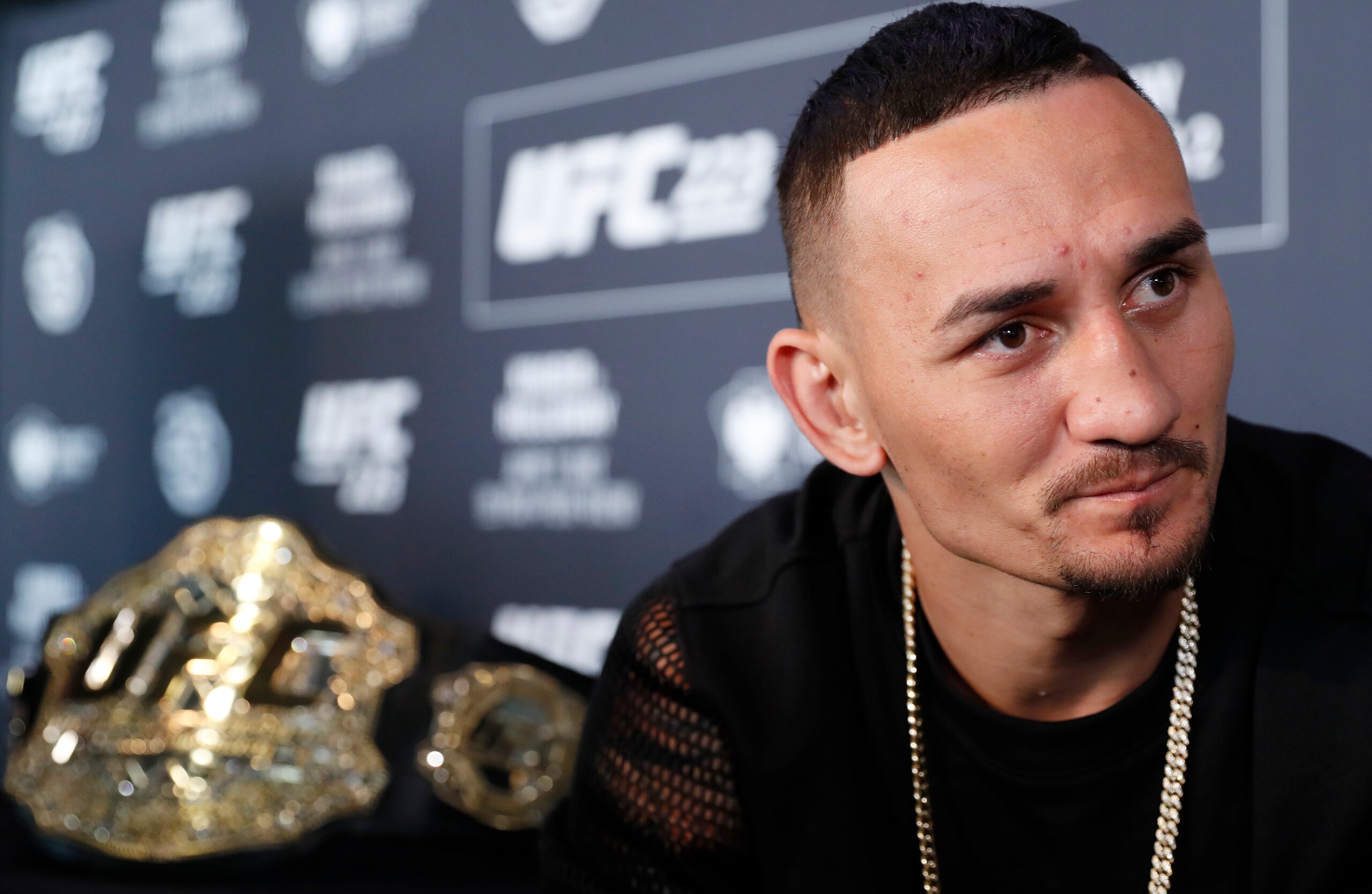 UFC featherweight champion Max Holloway responds to reporters' questions during a media event, Thursday, April 5, 2018, in New York, ahead of his lightweight title fight against Max Nurmamogedov, Saturday, April 7th. (AP Photo/Kathy Willens)